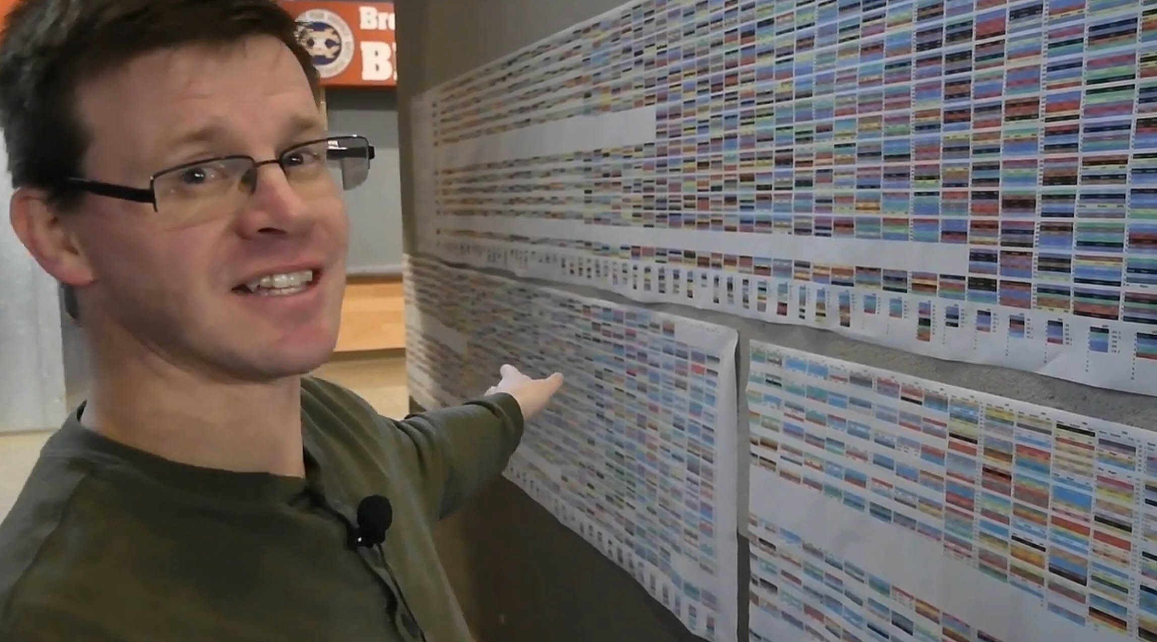 Spencer Condie of Wheatland stands next to a large printout he created for the Montana State Wrestling Championships displaying every place-winner from every year of the tournament. He began his project with Wyoming wrestling and has been asked by several states to do it there as well.