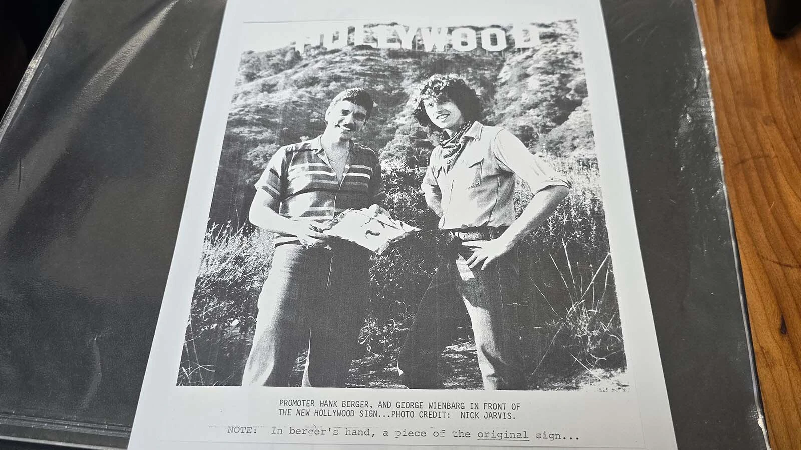 Hank Berger, left, and his friend George Jay Wienbarg III in a newspaper clipping about their efforts to sell pieces of the famous Hollywood sign for souvenirs.