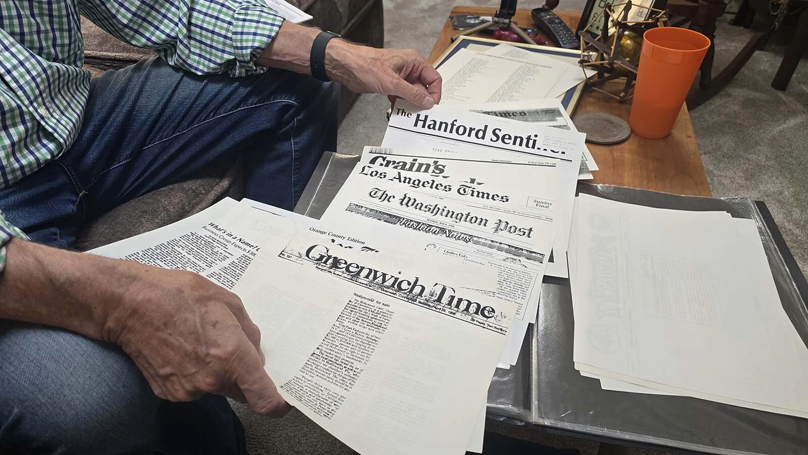A sheet of newspaper clippings highlighting Wienbarg's efforts to sell pieces of the Hollywood sign as souvenirs.