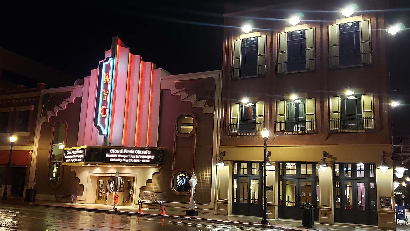 The WYO Theater late at night, lights up Sheridan's Main Street.