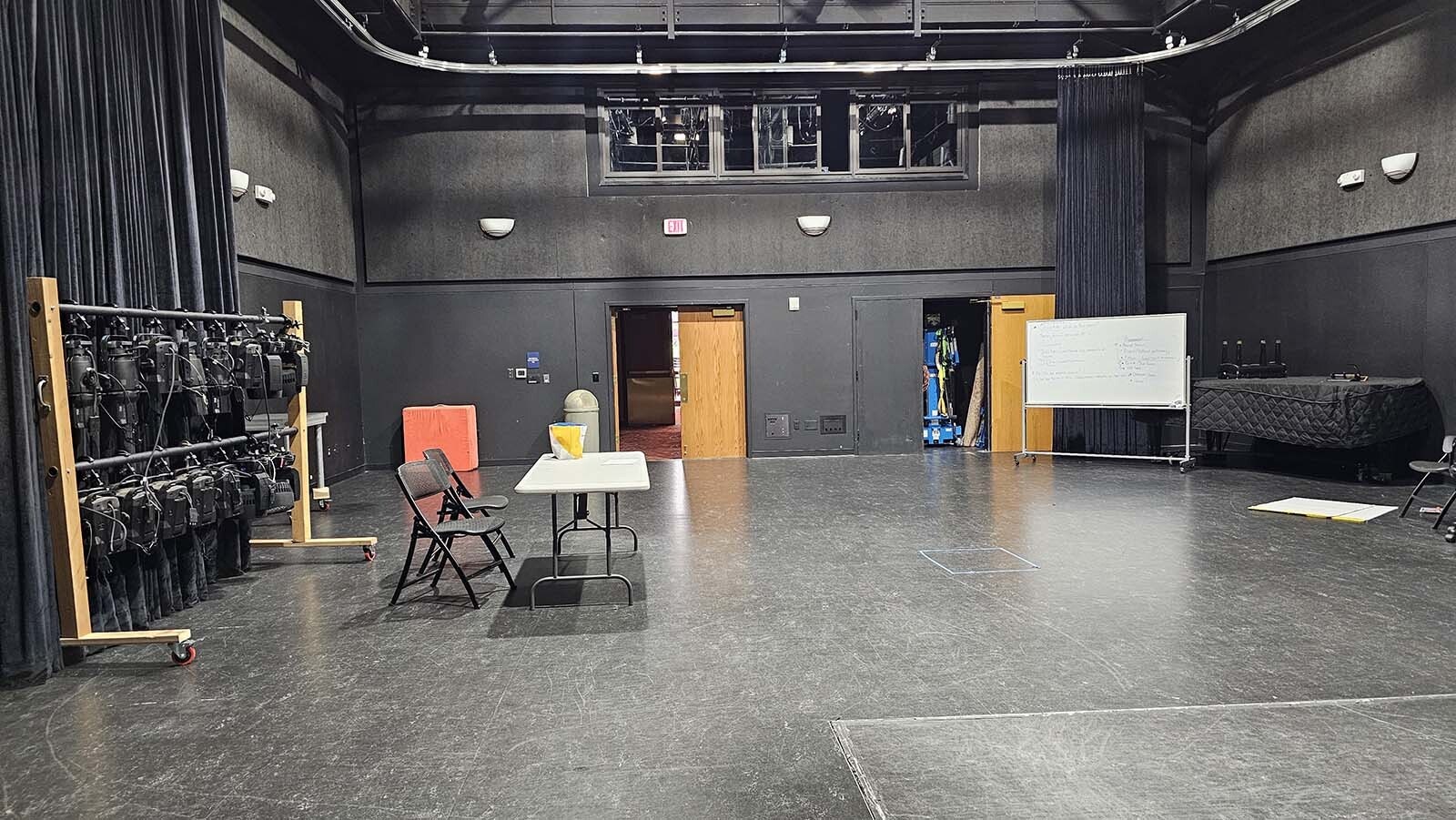 This type of stage setting is referred to as a black box, because everything can be moved around, including the stage and the seating. That makes it a versatile performance space, available at The WYO Theater.