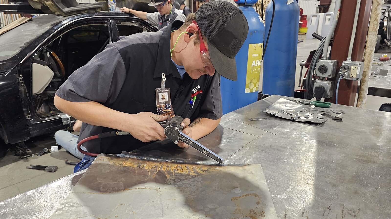 Ethan Arganbright works on a panel he's adding to a truck he's restoring for his personal project at WyoTech. He graduates in two weeks with multiple job offers in Texas, and is still deciding which one to take.