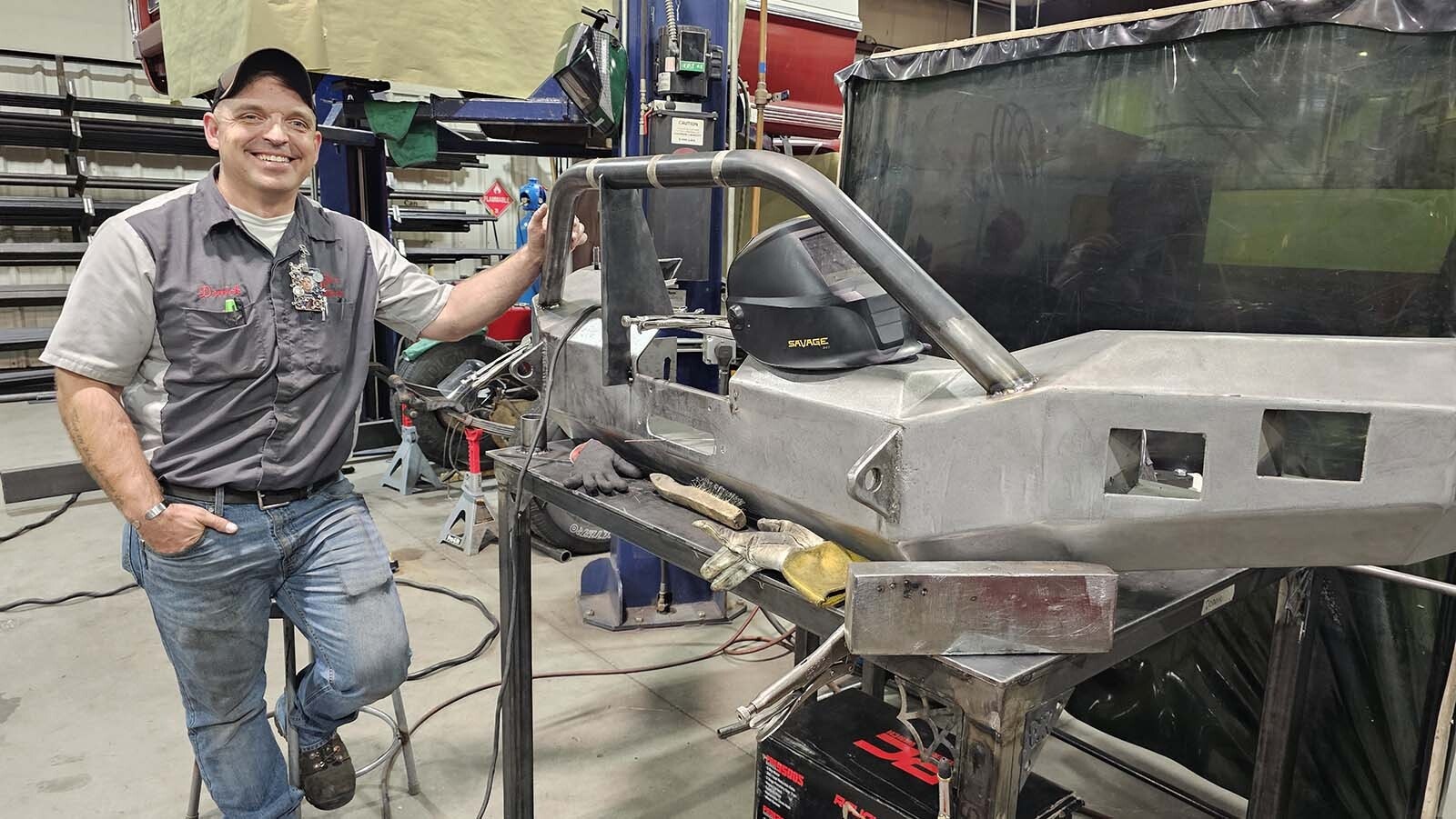 Derrick Peters stands with the custom bumper he's working on at WyoTech. He came to the school in hopes of finding a job in Wyoming. He graduates in two weeks with a job at Jackson Group Peterbilt in Cheyenne.