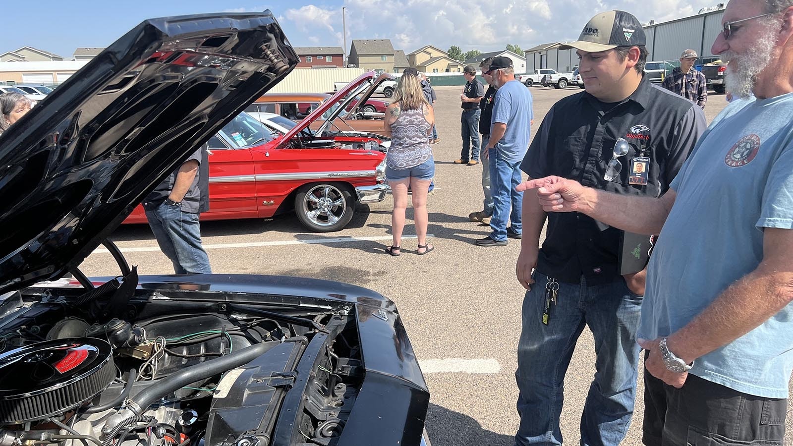 Dave Ratzlaff, owner of a 1969 Chevrolet Camero, talks about his car with WyoTech student David Solis at the Goodguys Rod & Custom Association car show on the WyoTech campus in Laramie on Thursday.