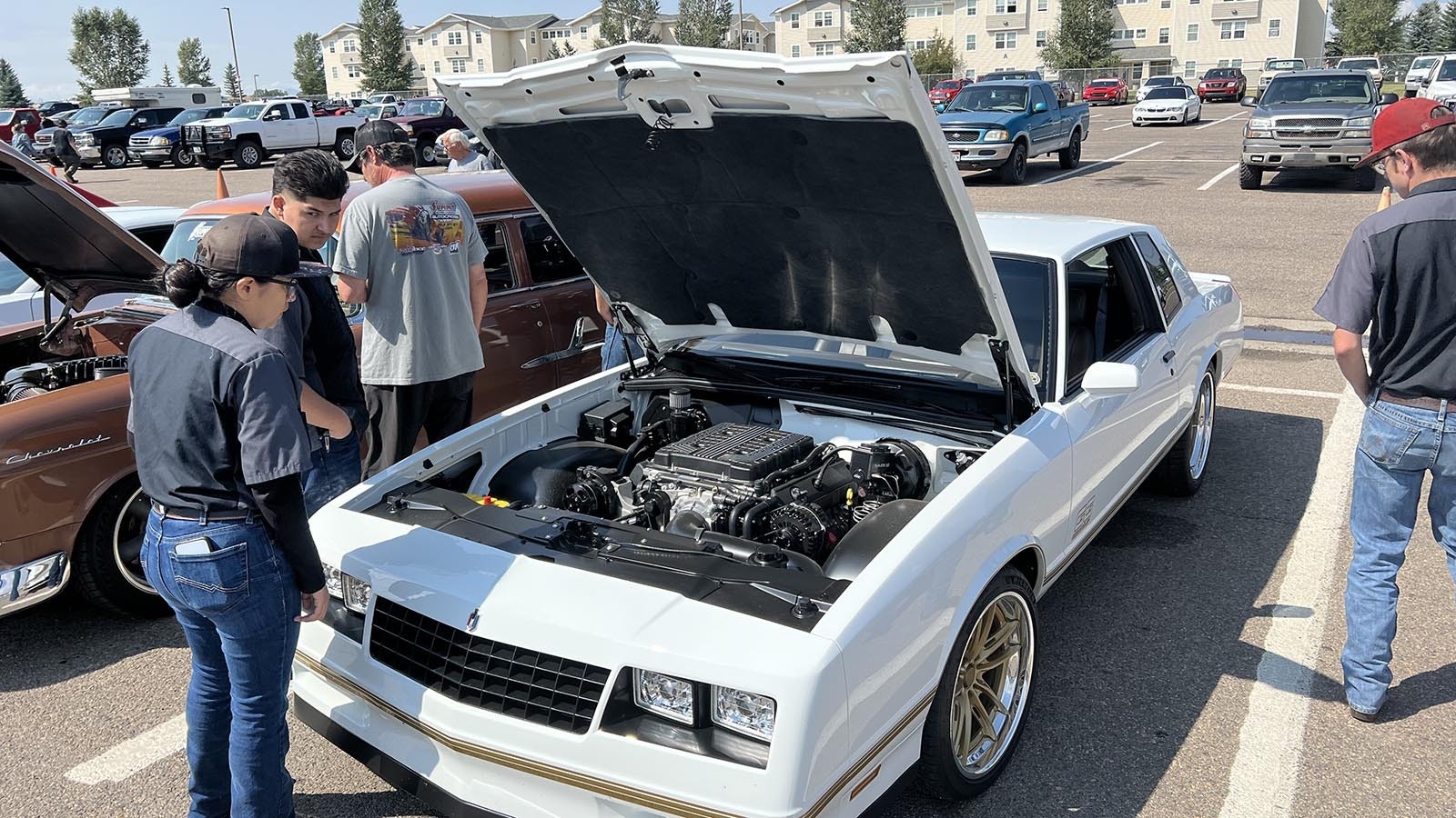 WyoTech students check out a custom-built 1987 Chevrolet Monte Carlo SS Aerocoupe at the Goodguys Rod & Custom Association car show on the WyoTech campus in Laramie on Thursday.