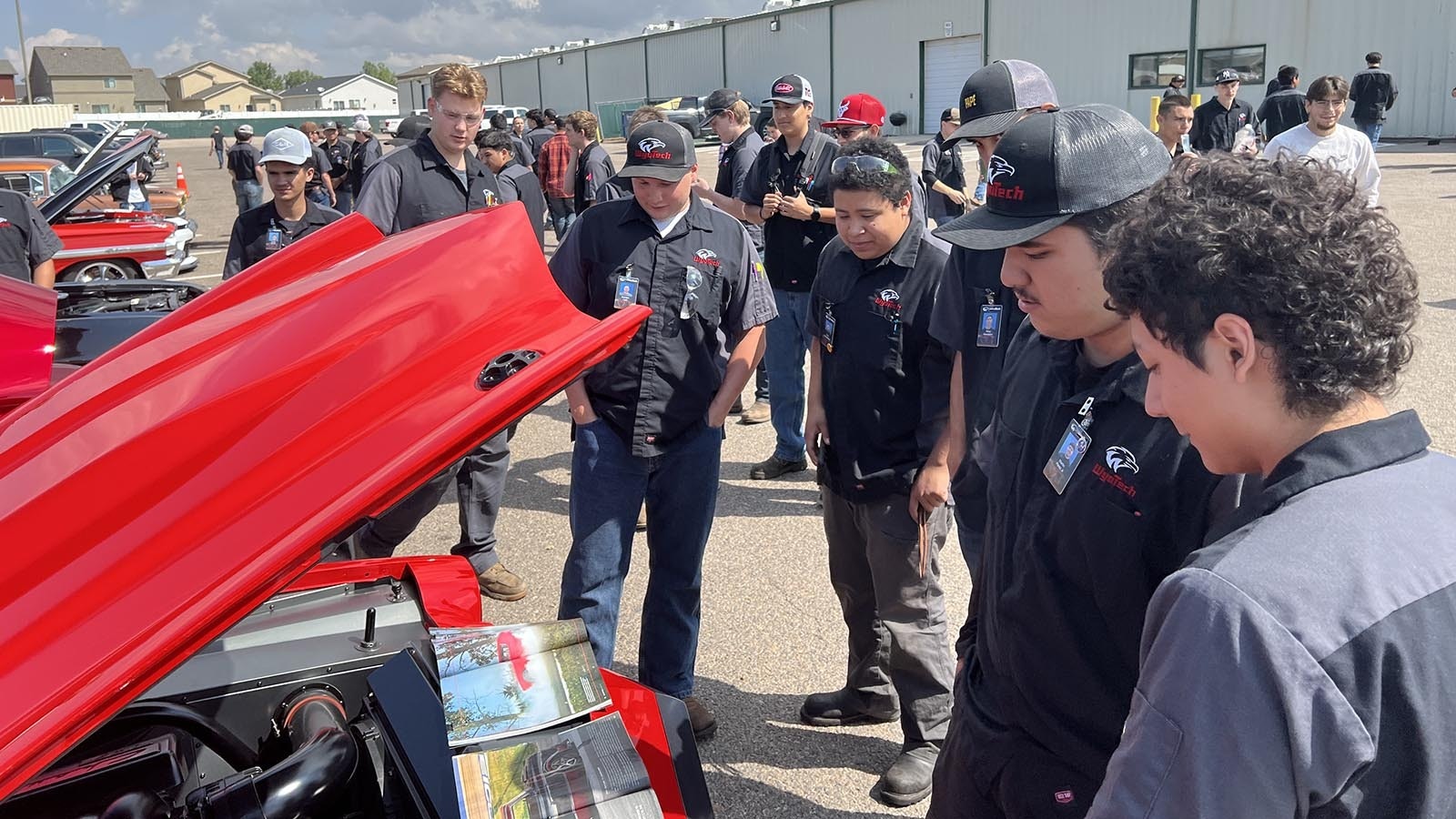 WyoTech students crowd around custom-built hotrods at the Goodguys Rod & Custom Association car show on the WyoTech campus in Laramie on Thursday.