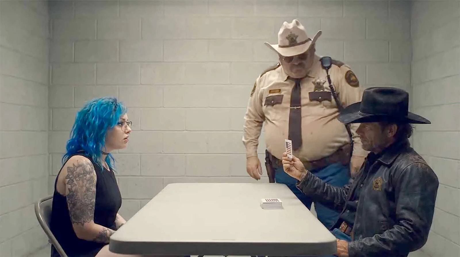 Wyoming Border Patrol Agents Buford and Rip question a Coloradan who wants to come to Wyoming. "What flag is this?" Rip asks while holding up a photo of an American flag. "Malaysia?" the Coloradan answers like a question.