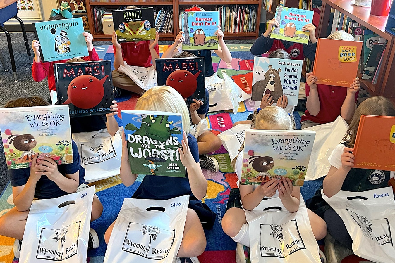 Jackson Hole Classical Academy first graders show off their book choices through the Wyoming Reads program.