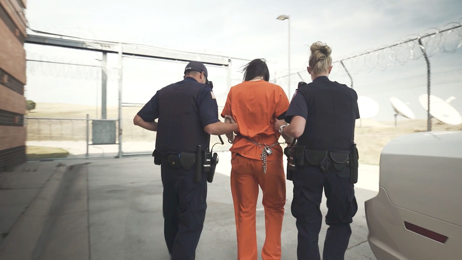 A pair of Wyoming Department of Corrections officers move an inmate.