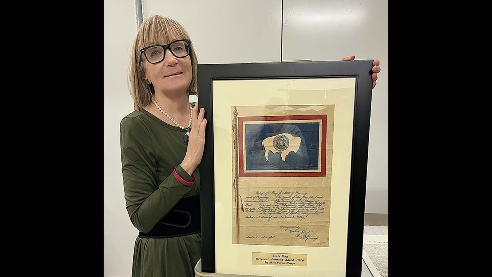 Rebecca Keays with her grandmother's original flag design.