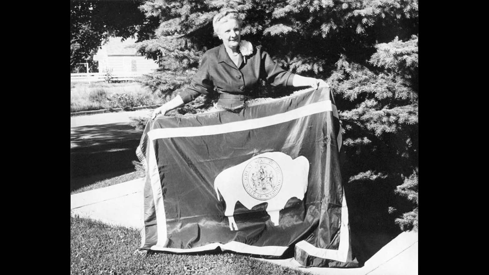 In this photo taken around 1960, Verna Keays Keyes holds the Wyoming state flag she desinged more than four decades earlier.