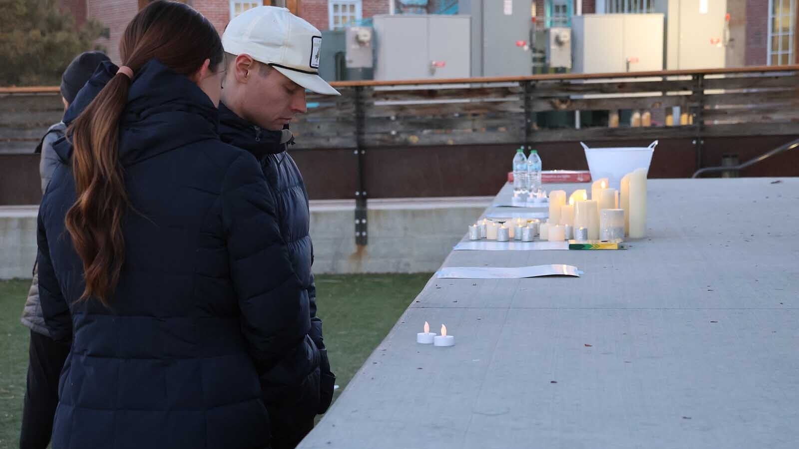 A Casper couple pray for Olivia at the stage. Some people attended the event for part of the hour, while others stayed for the entire event.