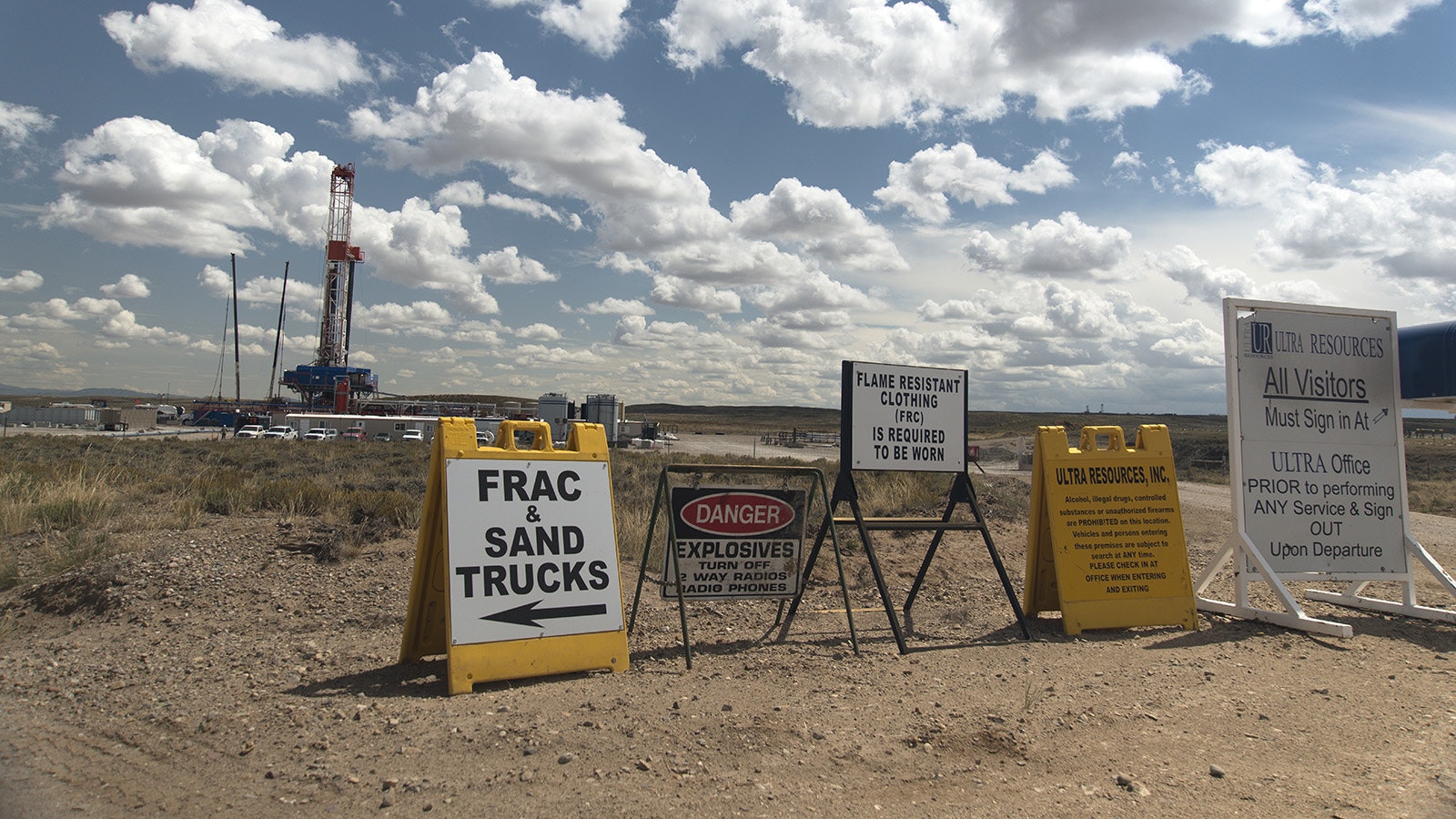 Signs outside an oil well site in Wyoming in this file photo.