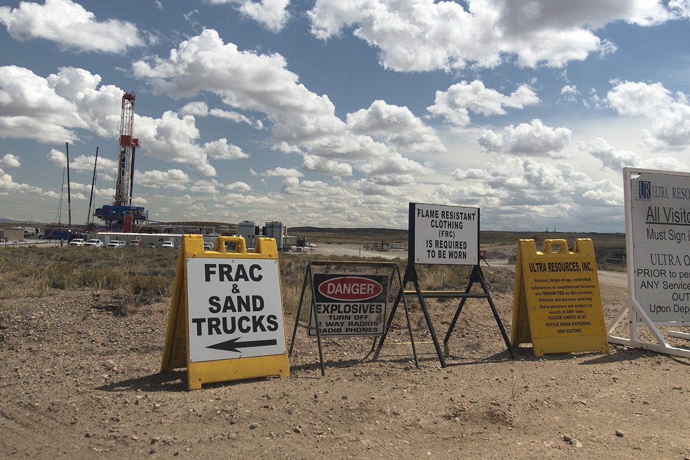 Signs outside an oil well site in Wyoming in this file photo.