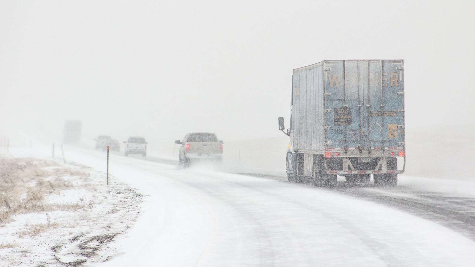 Traffic drives through a Wyoming snowstorm on Interstate 80.