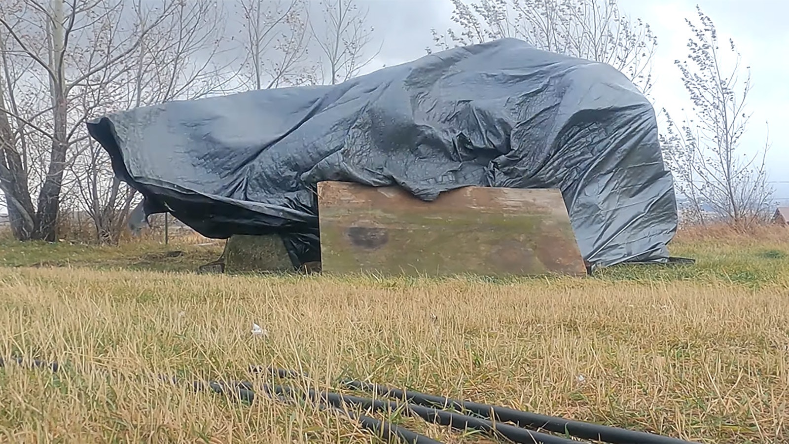 Without being covered, strong winds and gusts could wreak havoc on hay stored outdoors.