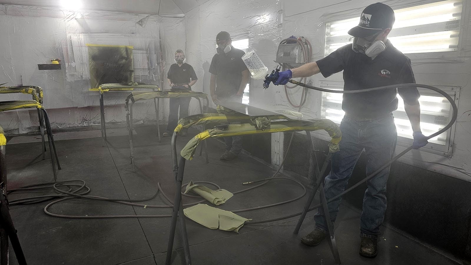 Students learn how to do custom finish work in one of the paint rooms at WyoTech.