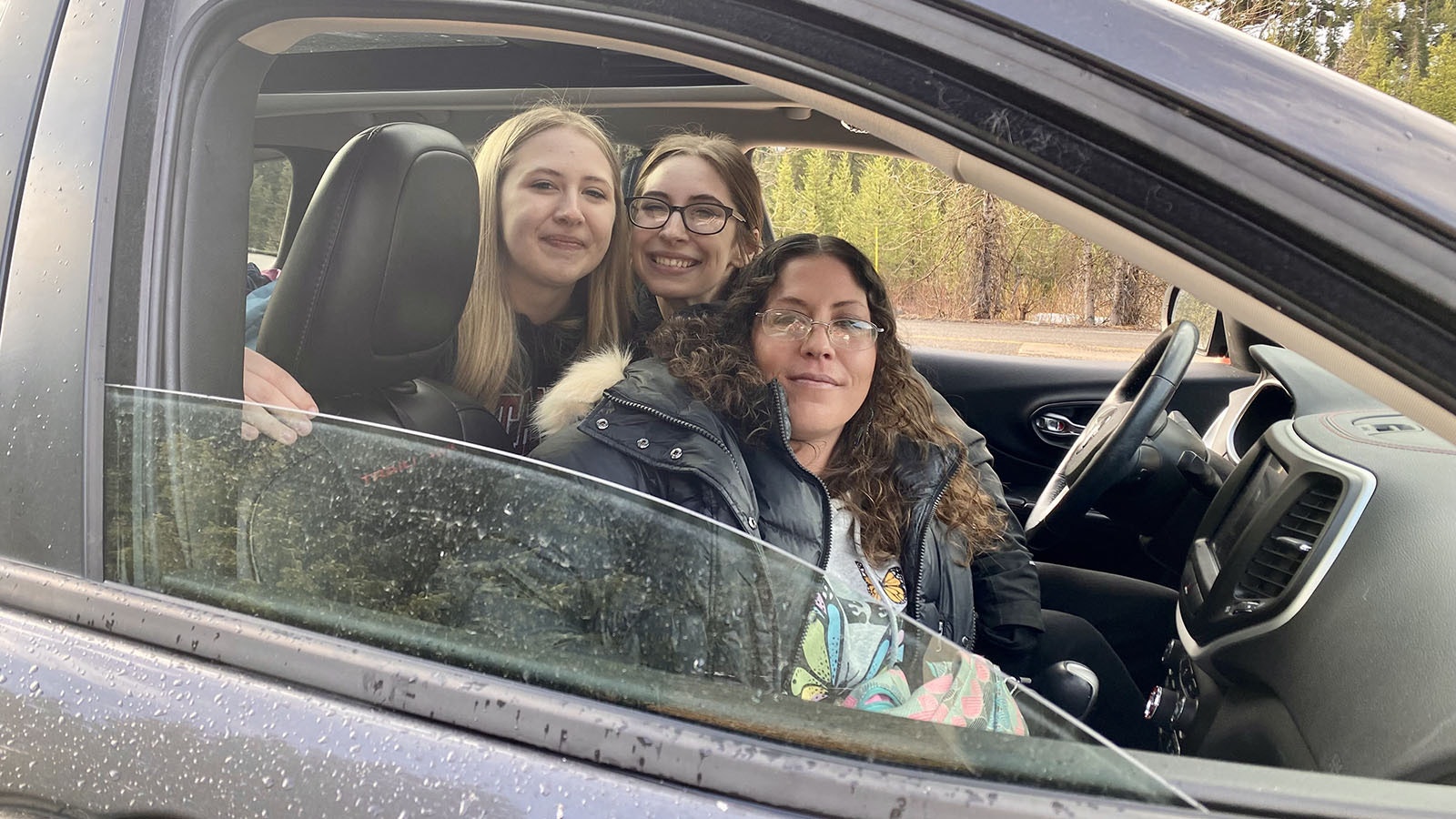 Stacy Boisseau with her daughters, Hailey and Kiya, on May 5, 2024, first in line for the opening of Yellowstone's East Entrance.