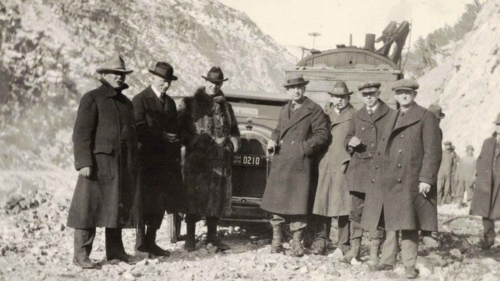 On Oct. 1, 1924, Wyoming Gov., Bryant Brooks waits by his car as crews clear the highway for the first official convoy to drive on the Yellowstone Highway through the Wind River Canyon.