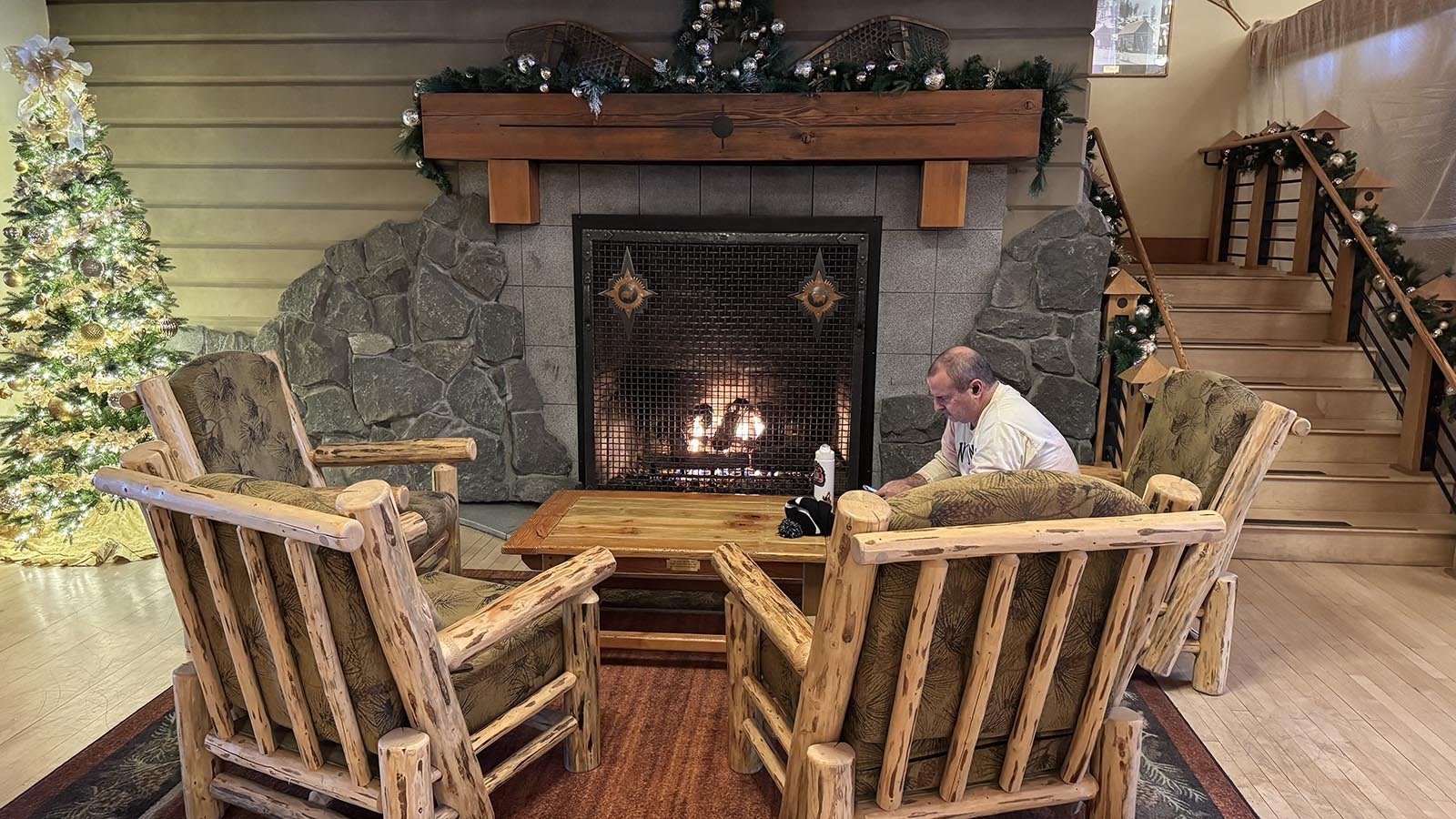 A fireplace in the lobby of the Old Faithful Snow Lodge, decorated for Christmas.