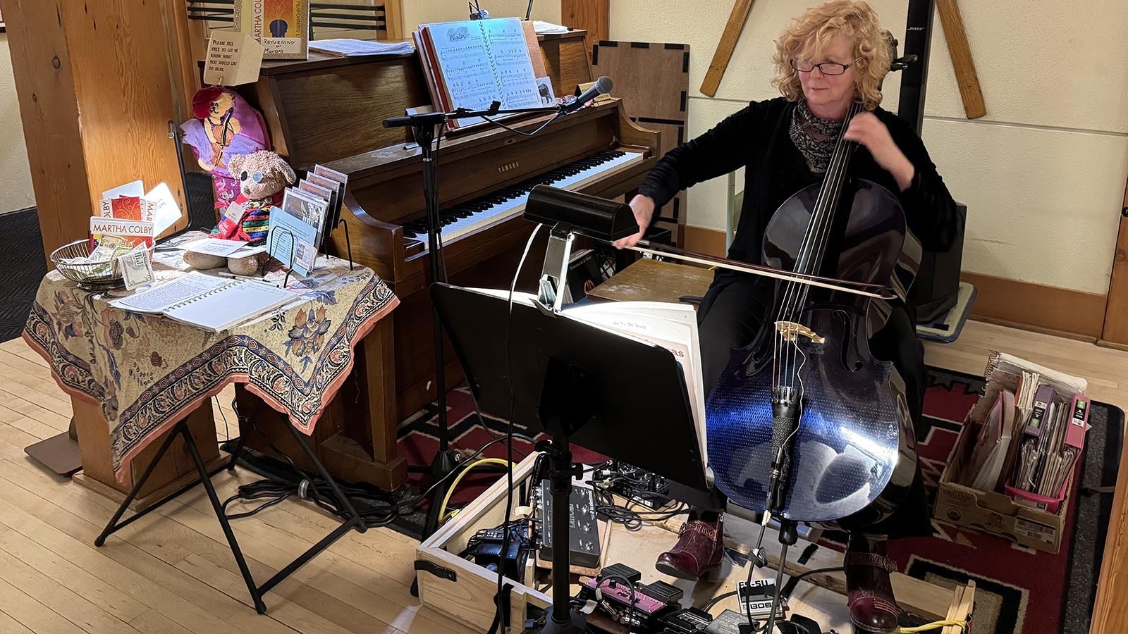 Musician Martha Colby plays "Good King Wenceslas" in the lobby of the Old Faithful Snow Lodge. This is her 13th winter playing music for four hours a night, five nights a week, at the Yellowstone hotel.