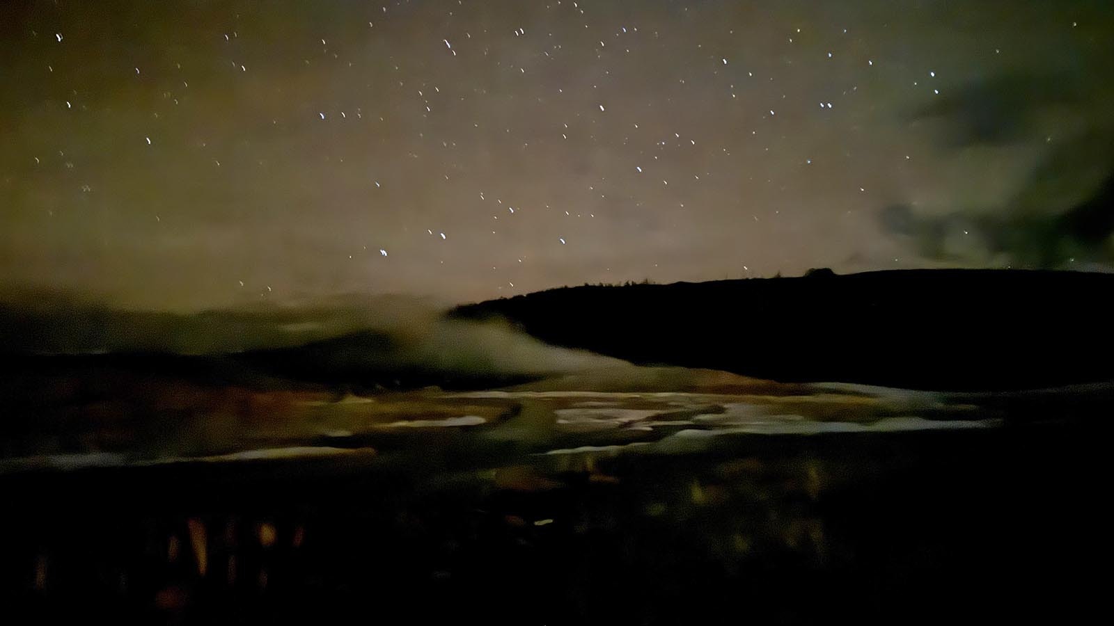 The Big Dipper over the steaming vent of Old Faithful in Yellowstone National Park.