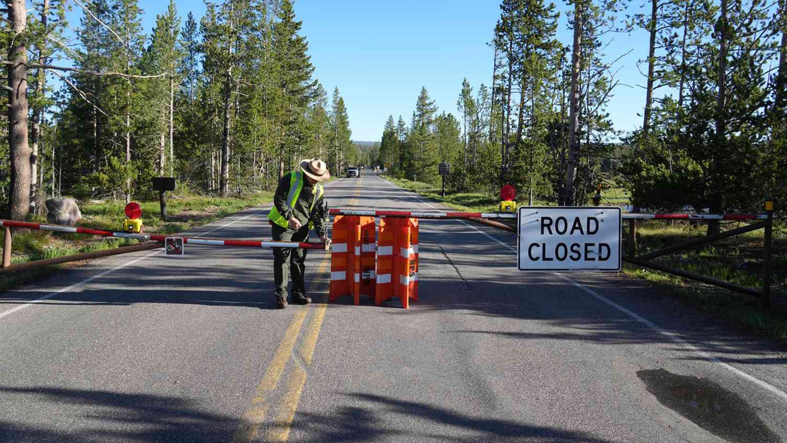 A National Park Service ranger closes a road in Yellowstone National Park in this file photo.