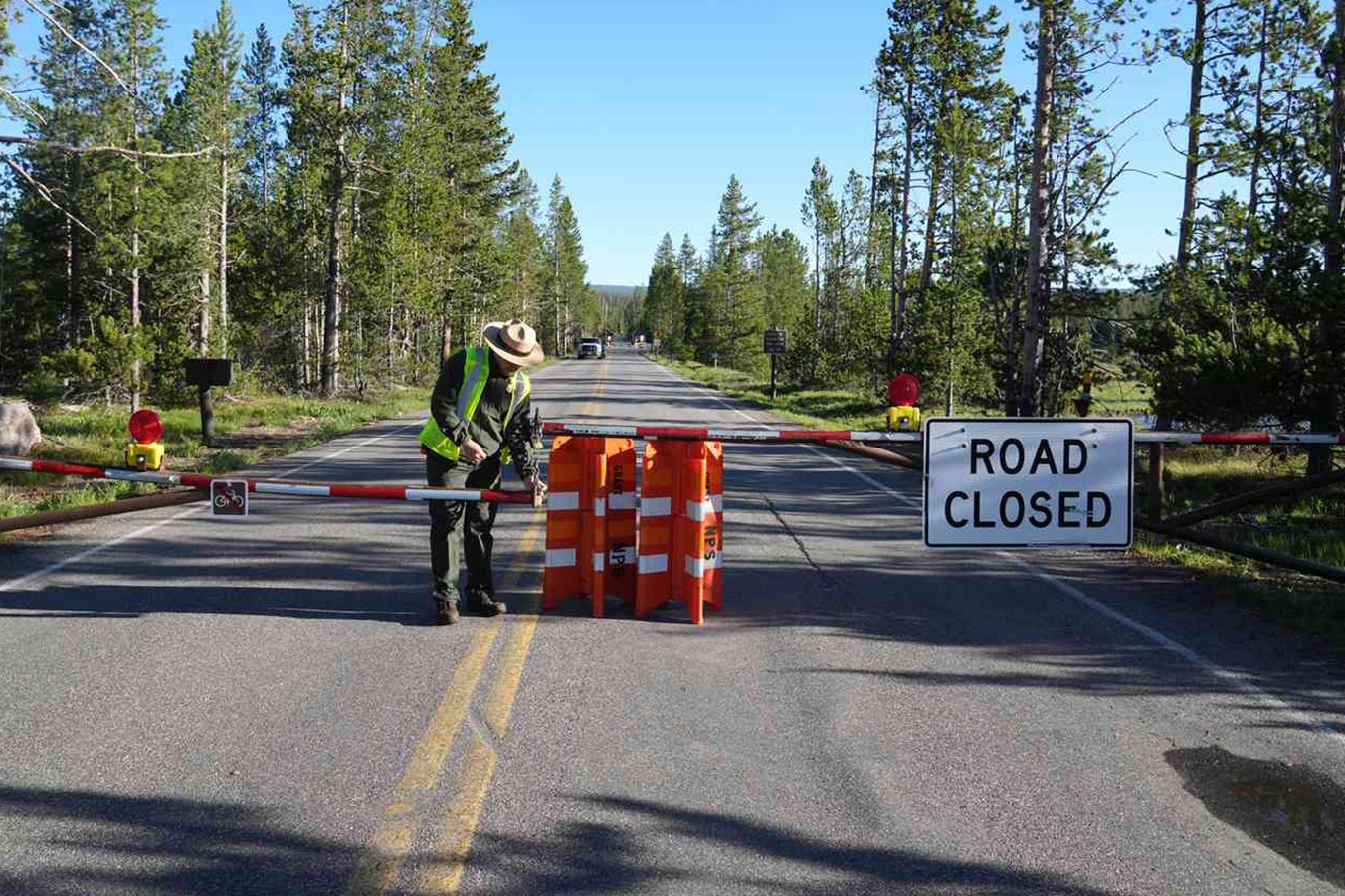 A National Park Service ranger closes a road in Yellowstone National Park in this file photo.