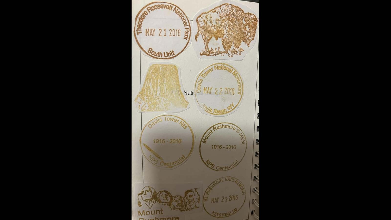 A series of stamps from Devils Tower and another National Park Service sites. The round stamps, with the date and locations, are part of the Passport to Your National Parks program, celebrating 40 years in 2026. The more intricate bison, Devils Tower, and Mount Rushmore stamps are much older and believed to have either been destroyed or stolen, as they haven't been seen or stamped in several years.