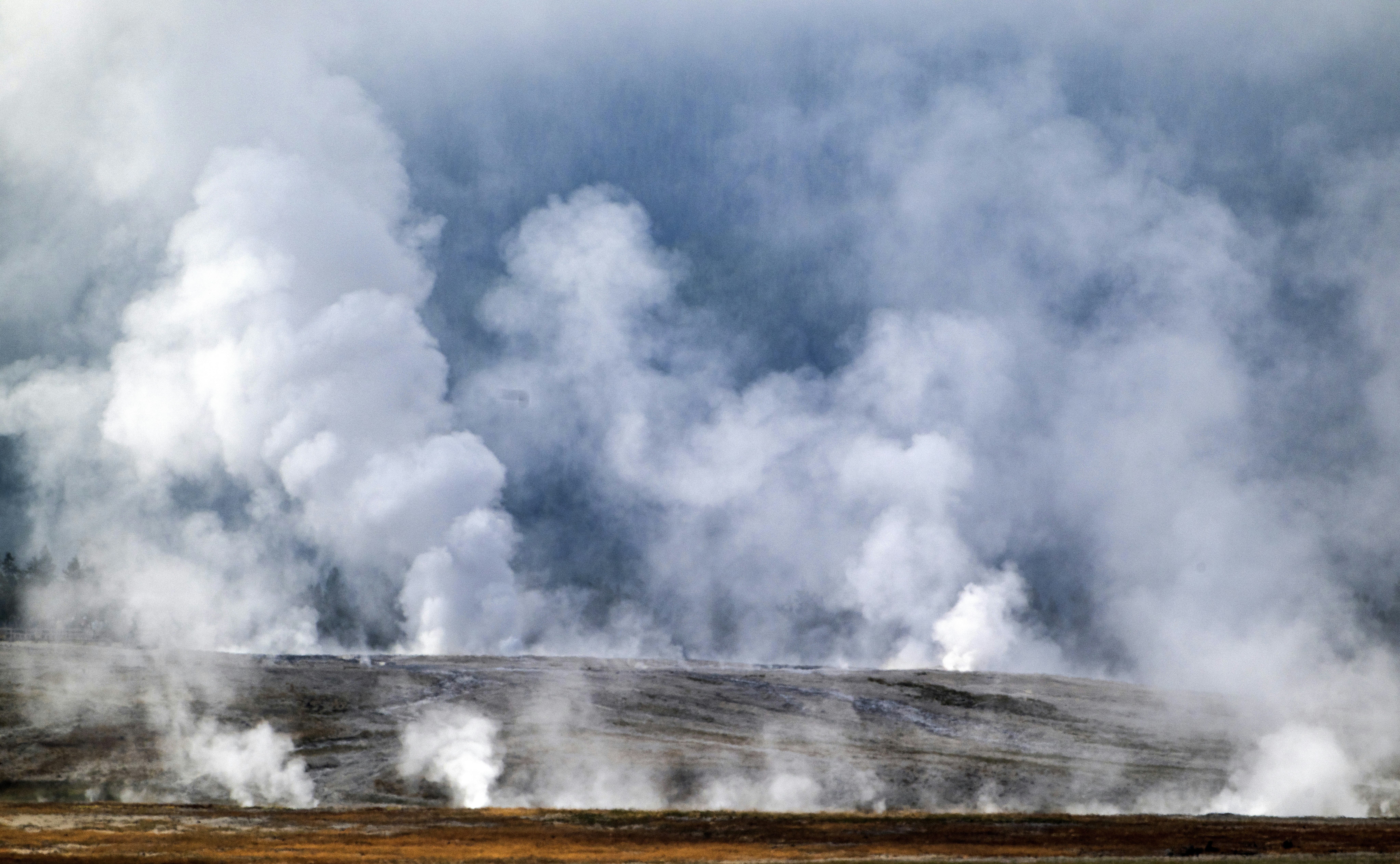 Steam rises from the various hydrothermal features at the Fountain Paint Pots geyser basin on July 31, 2024, in Yellowstone National Park, Wyoming.