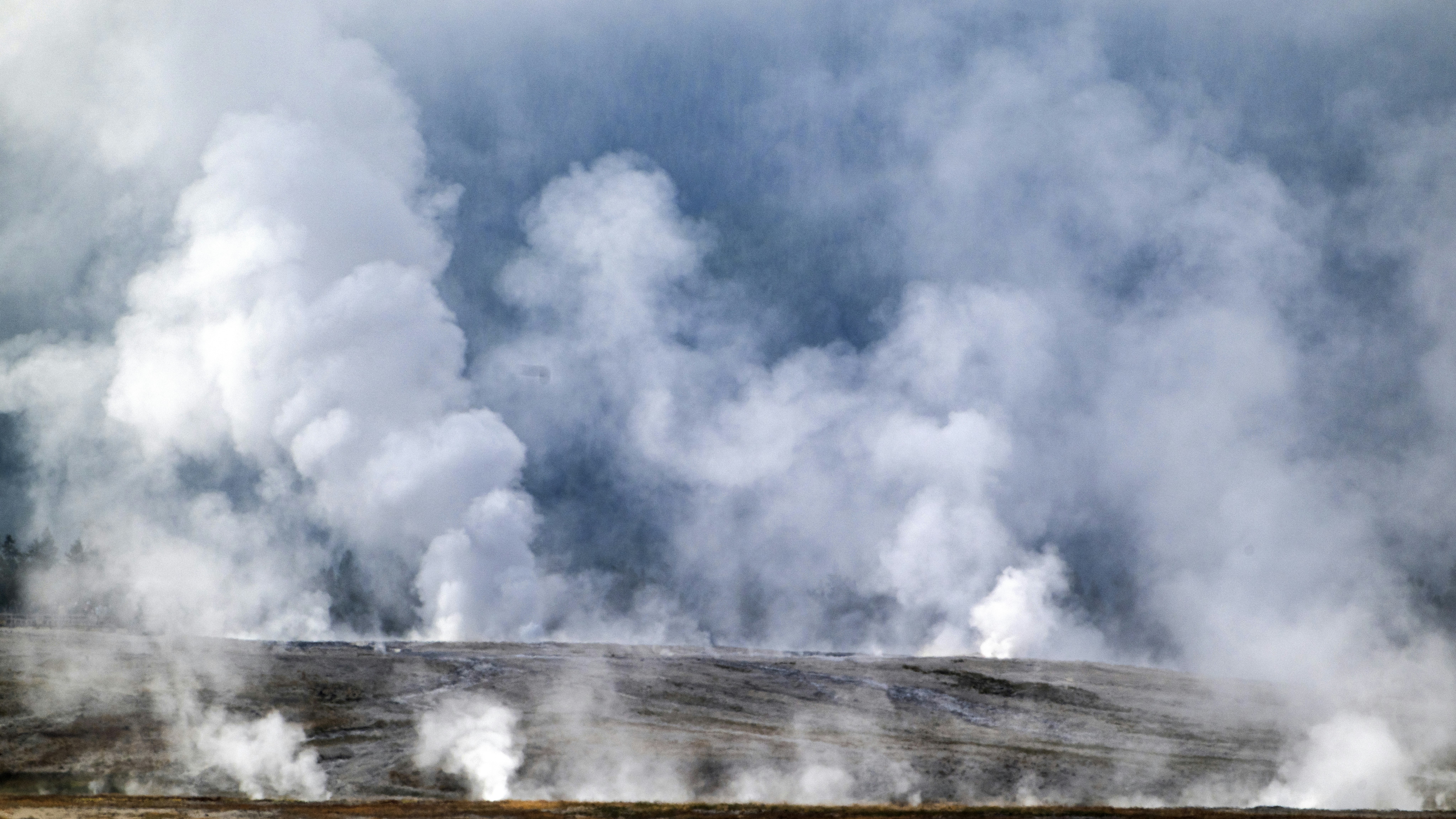 Steam rises from the various hydrothermal features at the Fountain Paint Pots geyser basin on July 31, 2024, in Yellowstone National Park, Wyoming.
