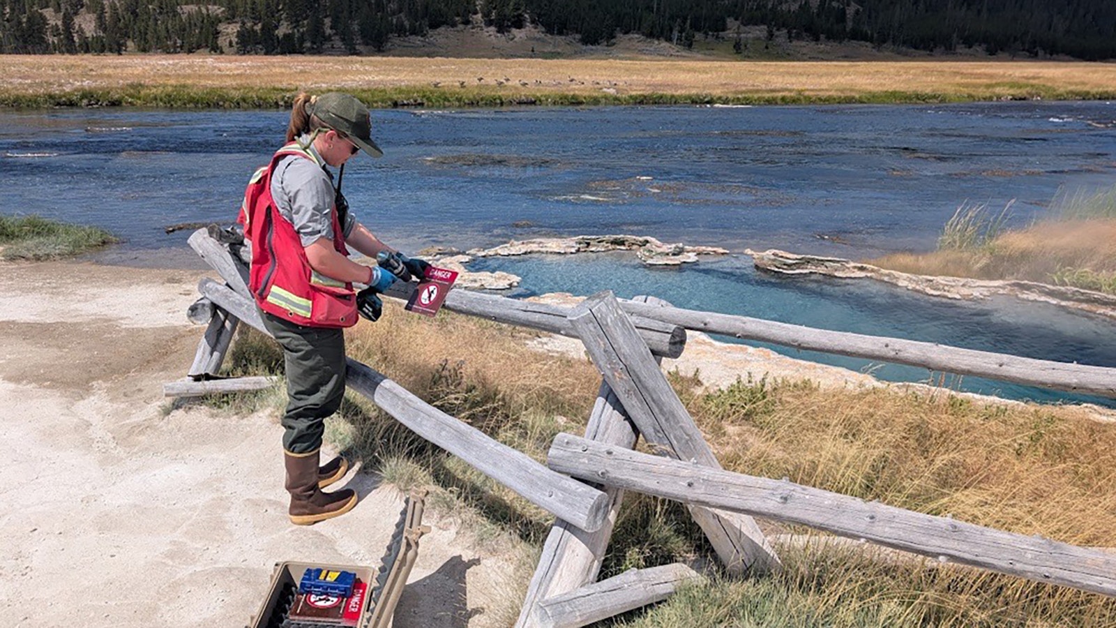 Yellowstone trash MBP installing sign at MG 9 13 25