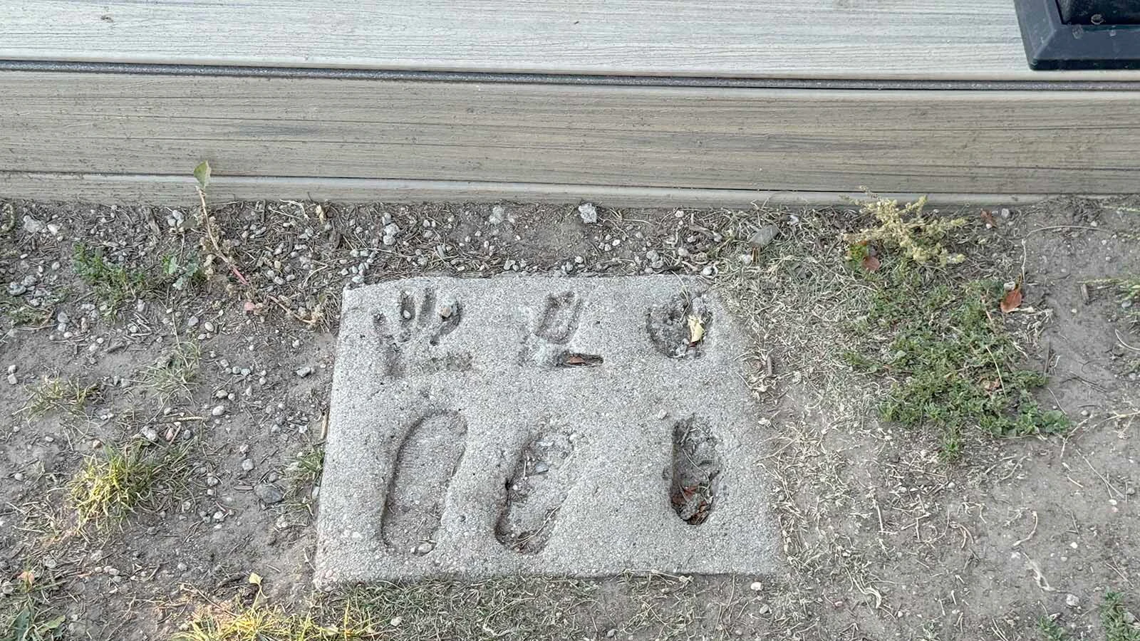 Keith and Cathy Yosten have lived in their home for 42 years. These 35-year-old hand and footprints from their kids are at the foot of the stairs to their front door in south Cheyenne.