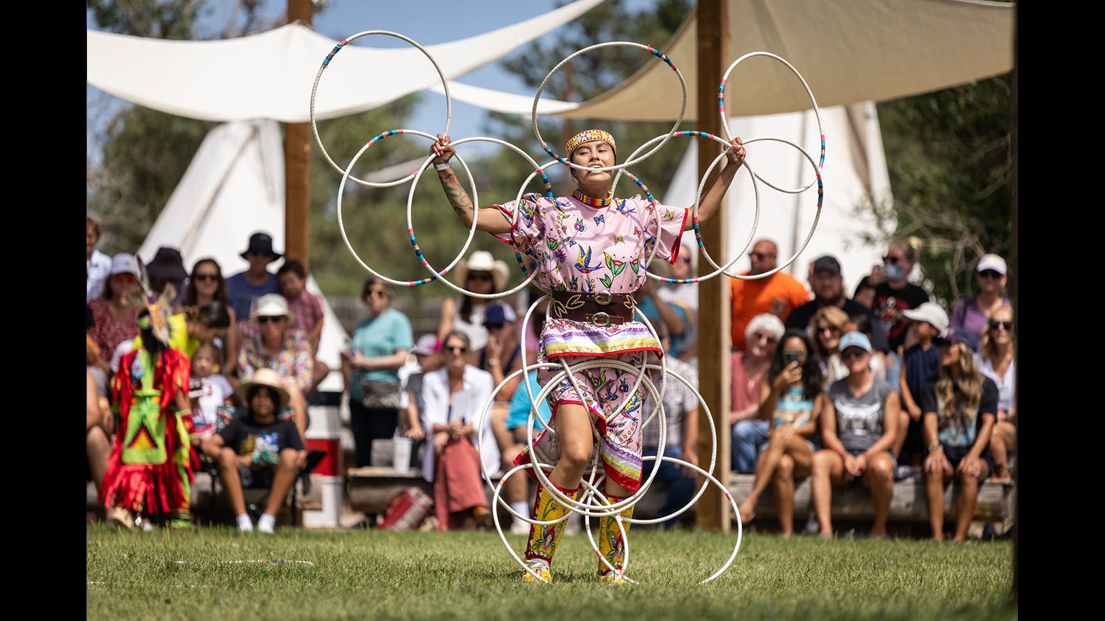 Zariah June Whiteplume performs a hoop dance at Cheyenne Frontier Days.