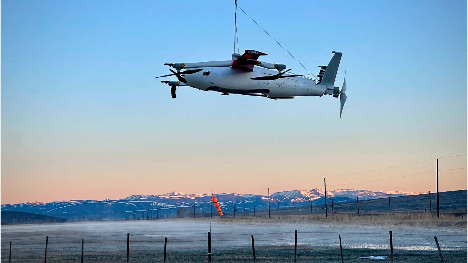 Zipline's P2 drone against the backdrop of a mountain range in Wyoming.
