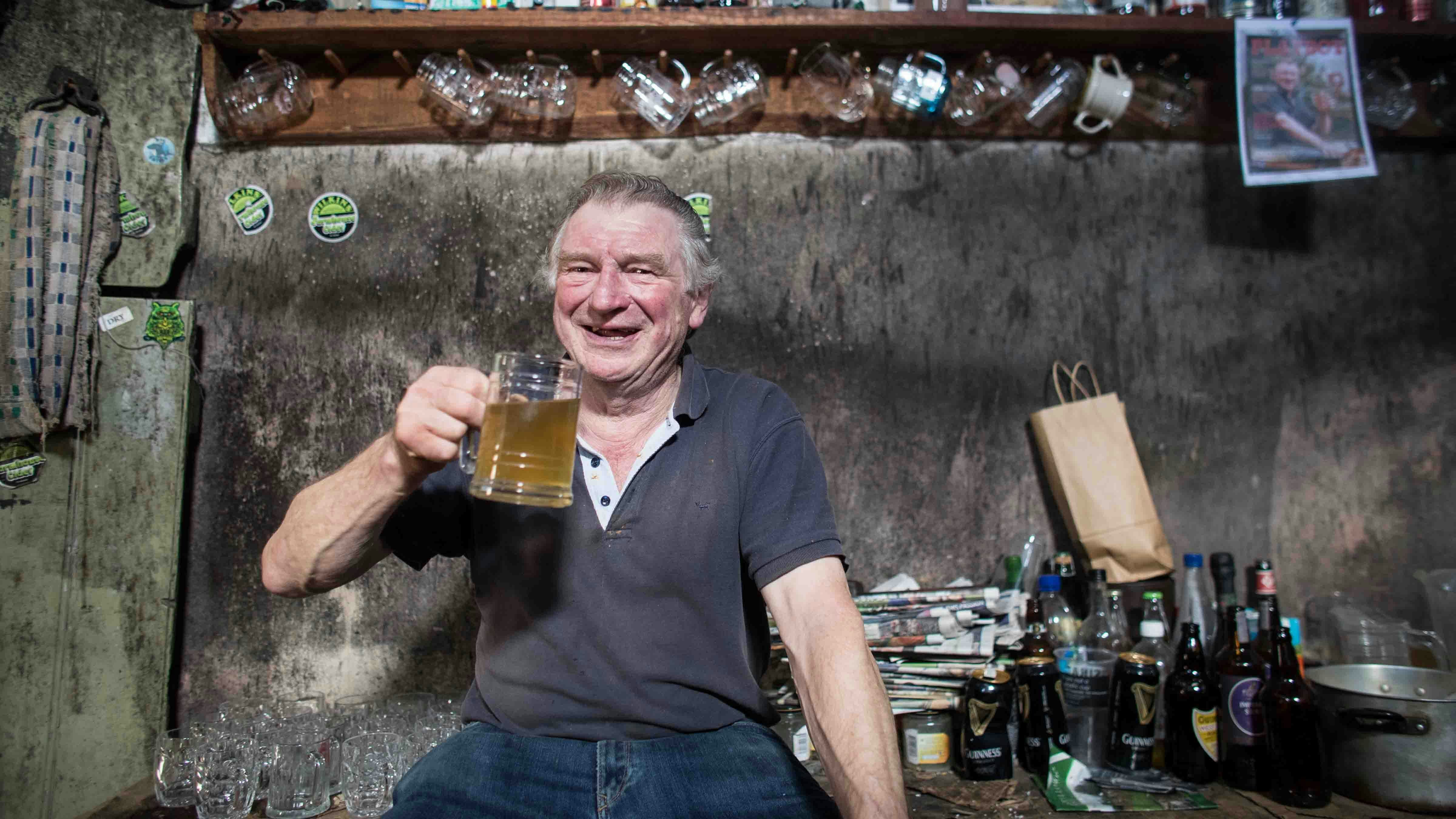 Inebriated man drinking some potent apple cider