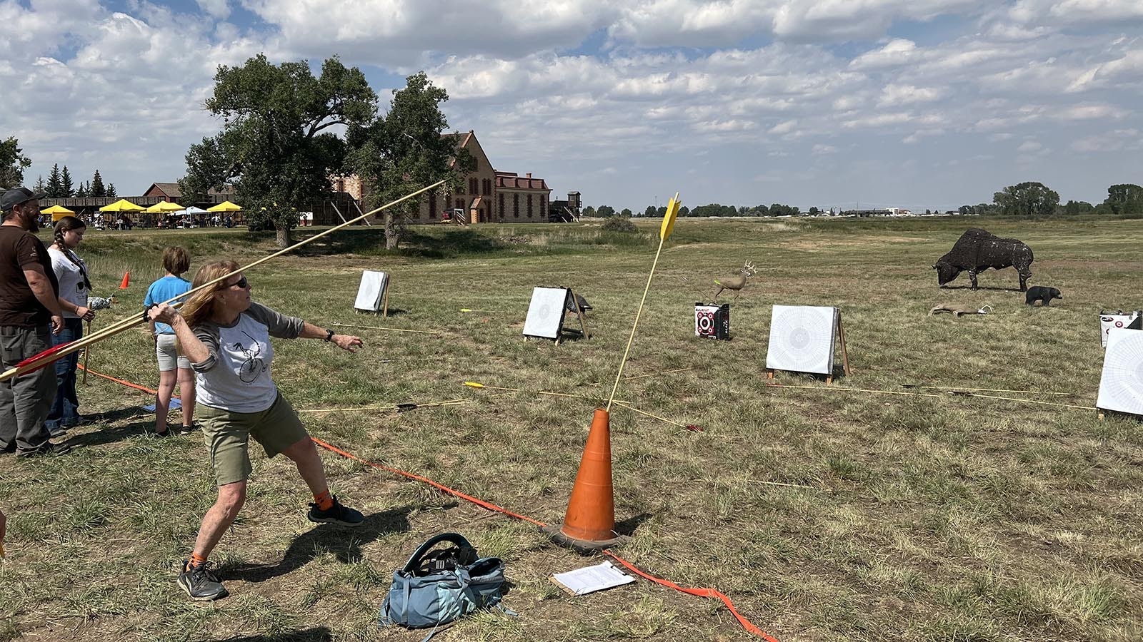 Amber Travsky tries her hand at a primitive weapon called an atlatl at the Wyoming Archeology Fair in Larmie on Saturday.