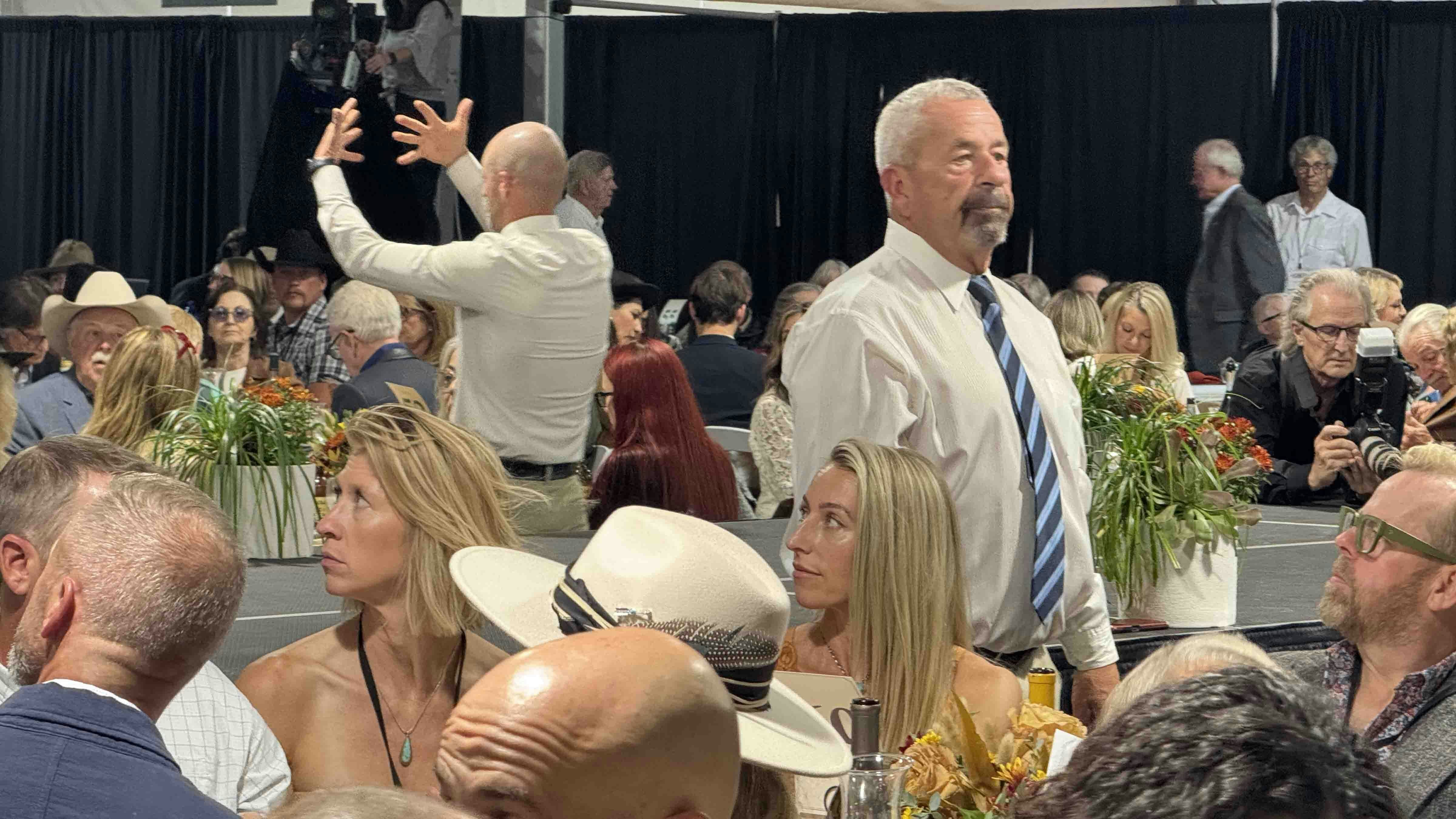 Auctioneers with Black and Associates Auctioneers keeping their eyes open for bids during the 44th Buffalo Bill Art Show and Sale in Cody.