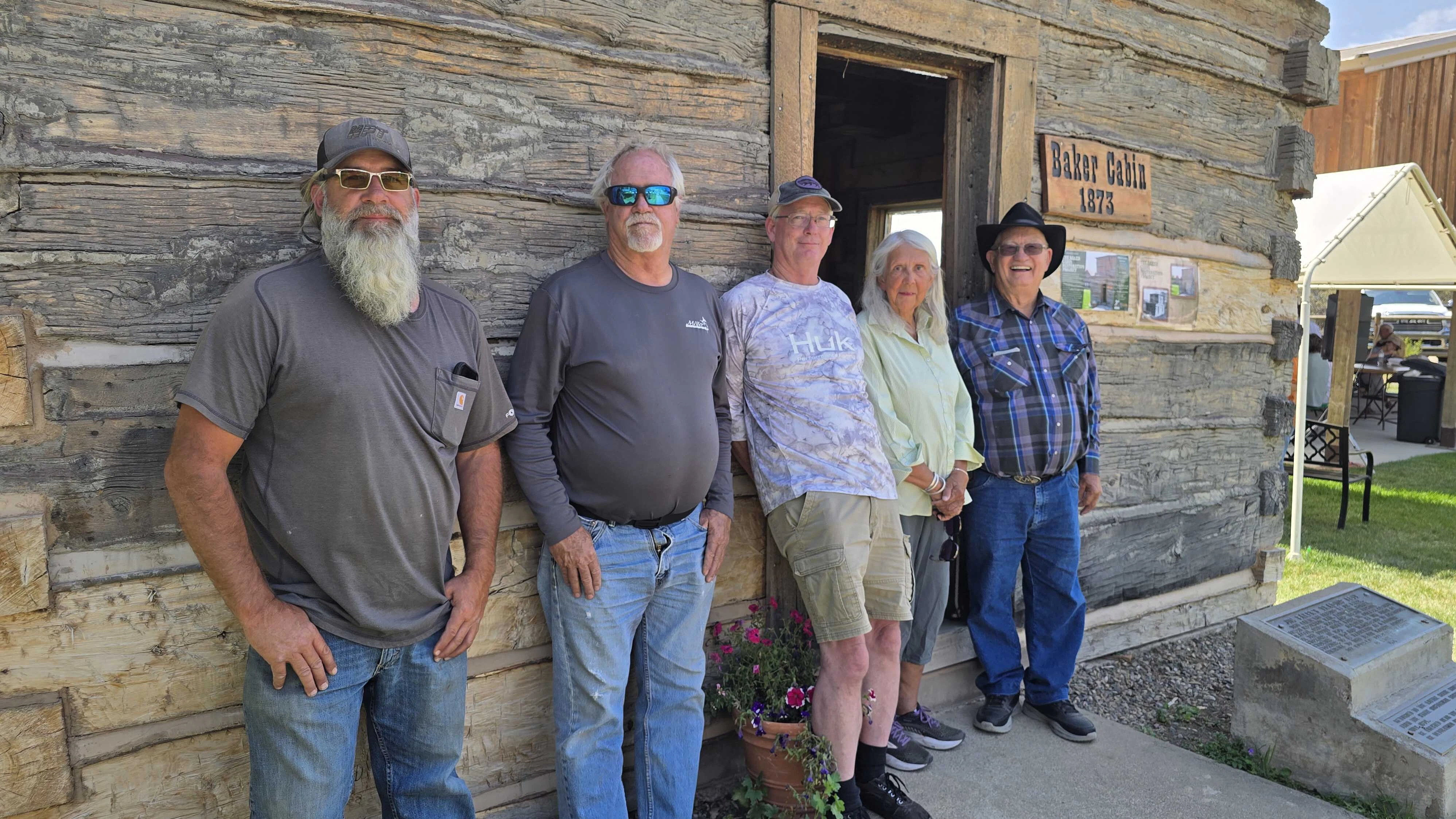 Descendants of Jim Baker attending the rededication of the famous mountain man's cabin from left are Michael and Paul McAllister, Chilly Rollison, Cynthia Reschke Collyard, and James Neeley.