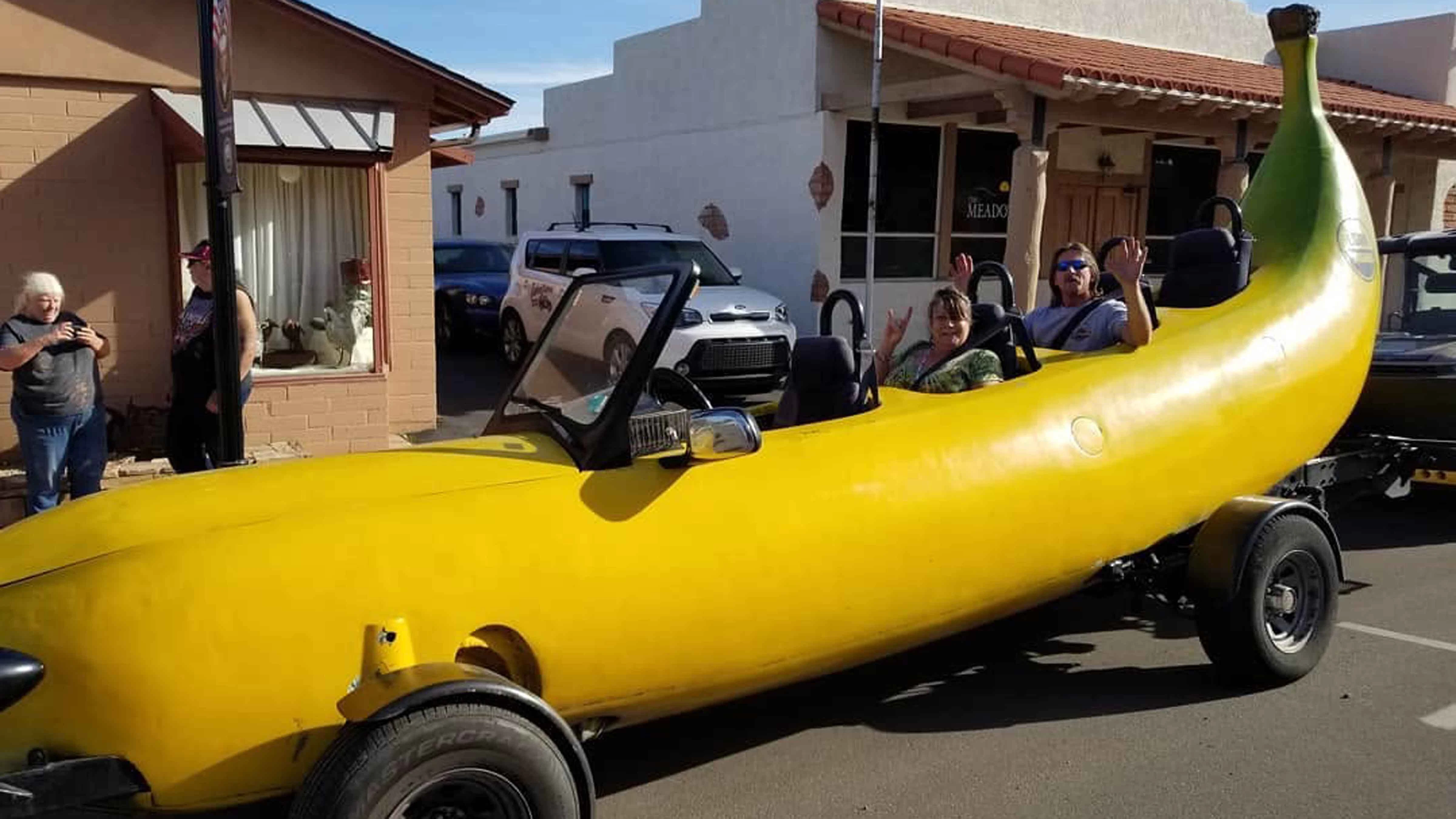 Passengers wave from the Big Banana Car during one of Braithwaite's many community appearances. He regularly offers rides and says meeting people is the best part of driving the giant fruit.