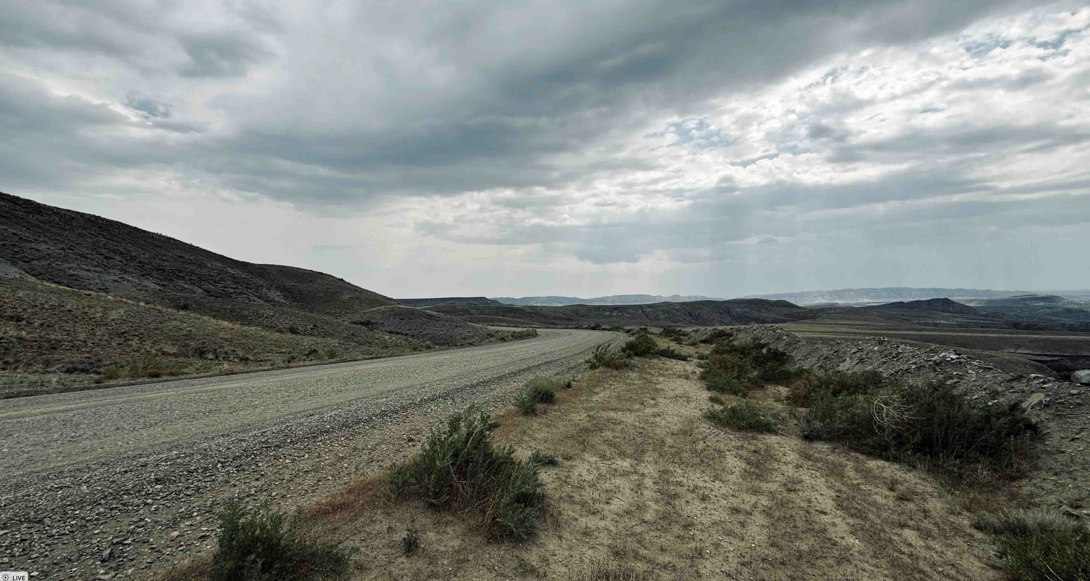 A 10-mile long road through the Bighorn Basin leading to a bentonite mining site in north-central Wyoming.