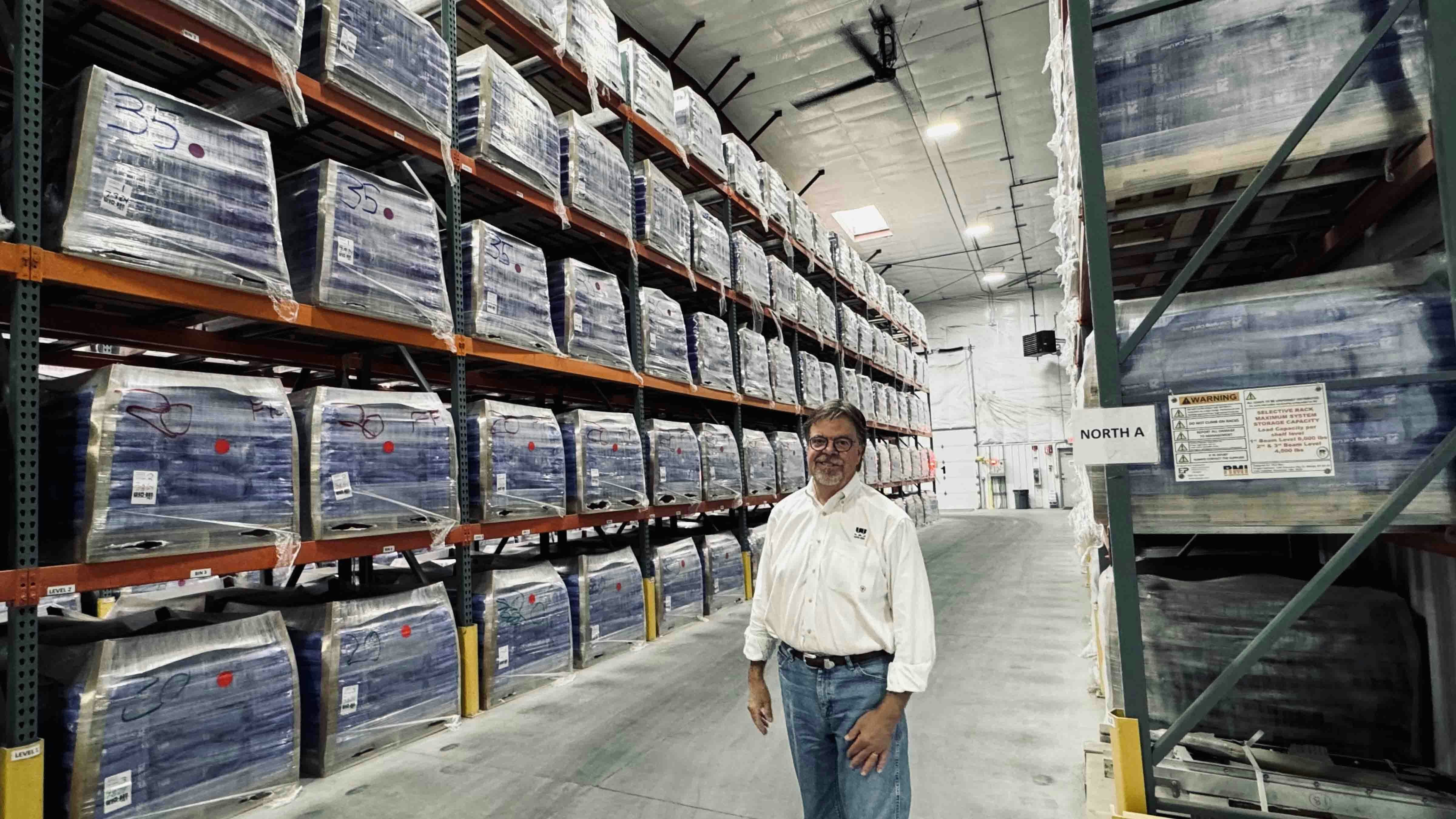 Wyo-Ben Inc. CEO David Brown standing inside the warehouse of a newly constructed cat litter processing plant in Billings, Montana, where some of the company’s bentonite ends up getting packaged into bags of cat litter for big retailers like Target’s Up&Up brand. The pallets are filled to the rafters in the warehouse with the cat litter.