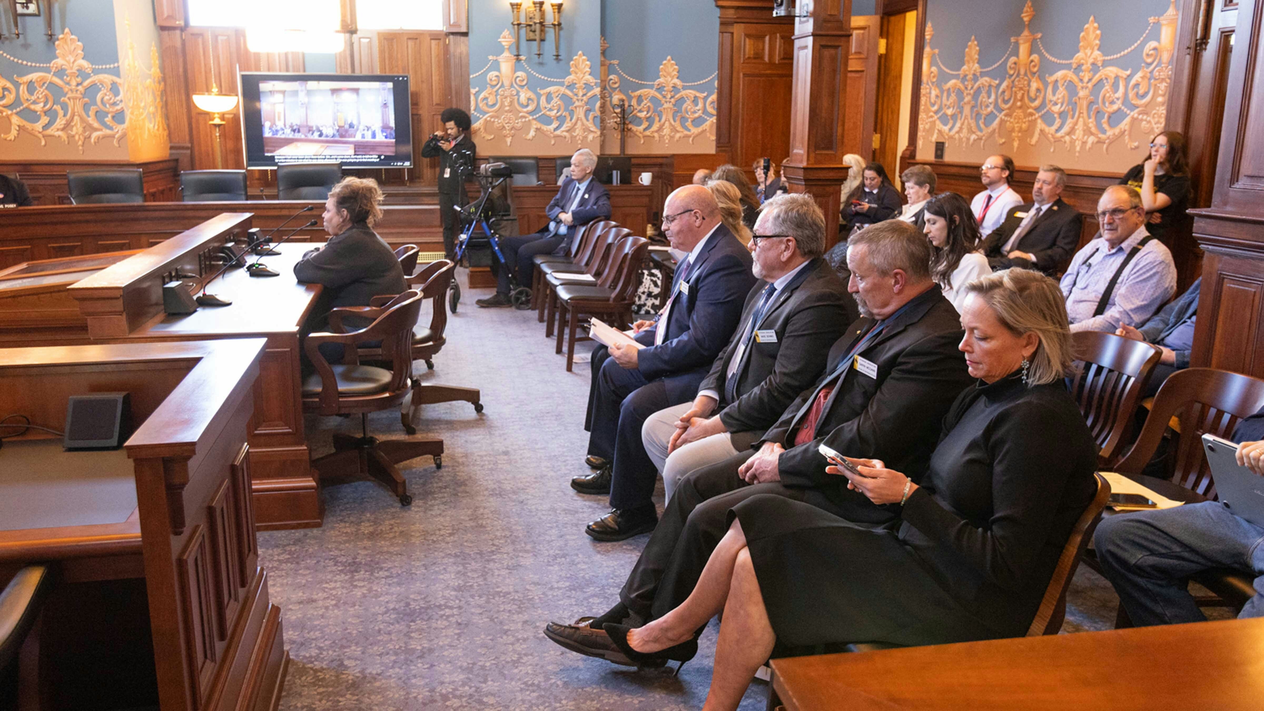 Witnesses and observers sit in the gallery Thursday for the House investigative committee about checks she handed out to legislators on the House floor on Feb. 9, 2026.