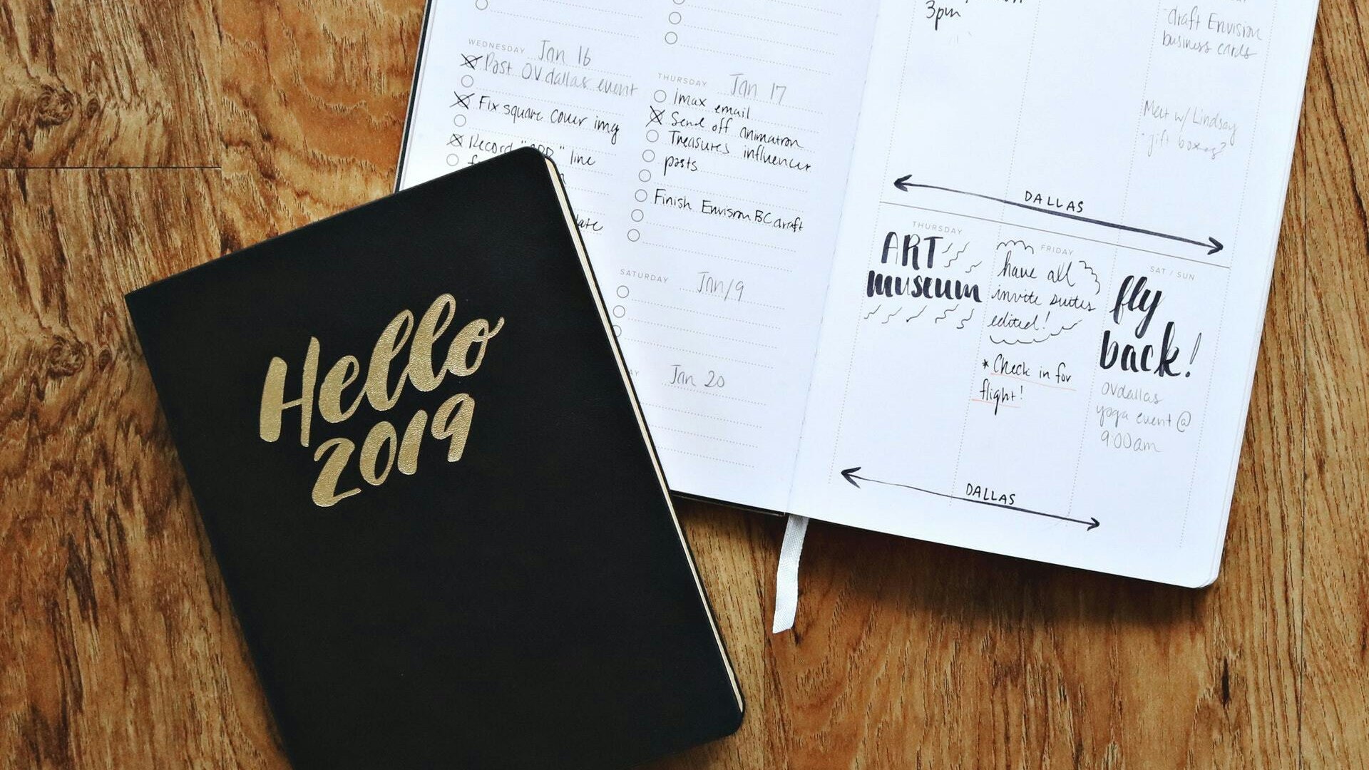 Black hello 2019 notebook on brown wooden surface 1937337