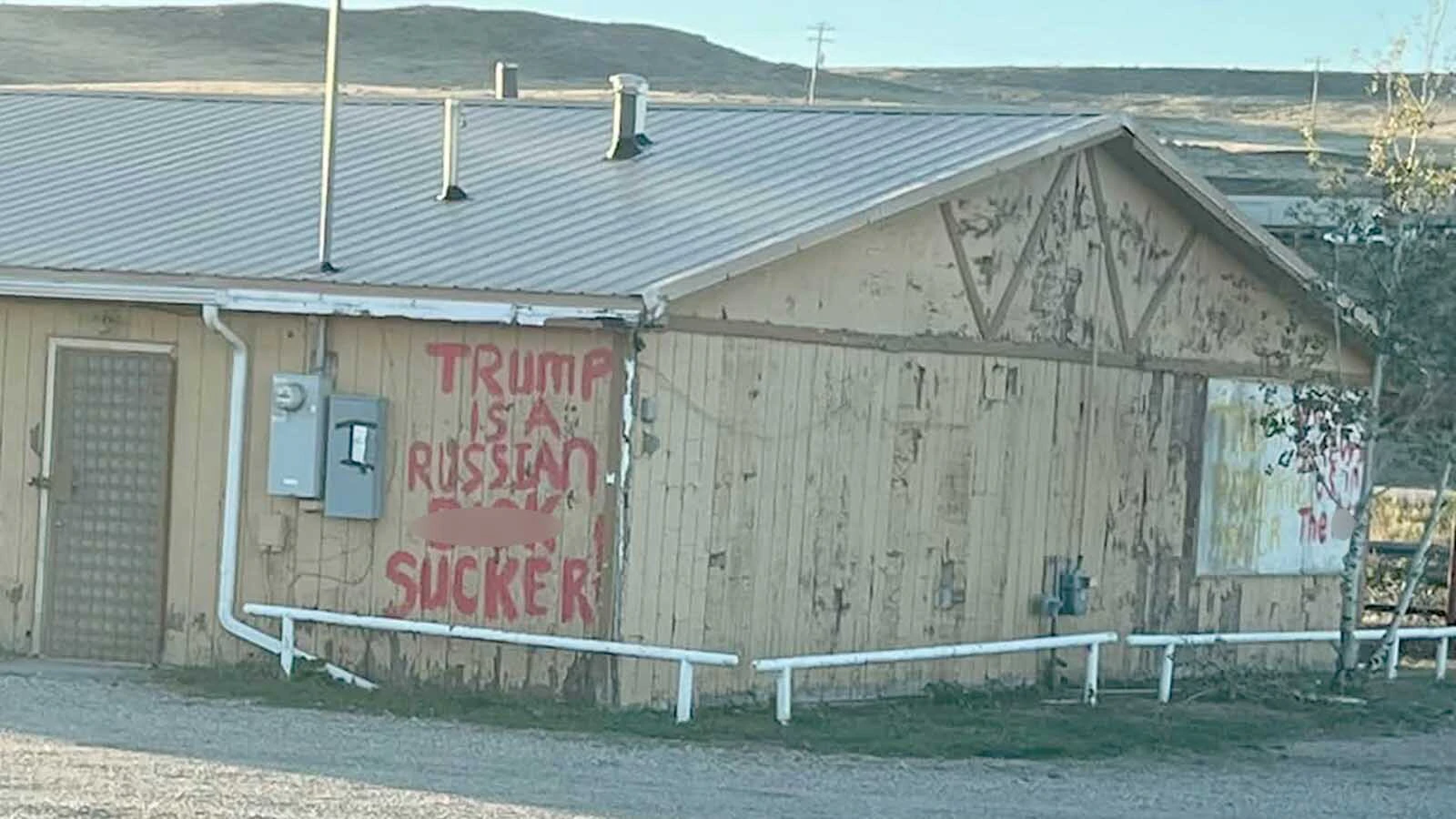 A profane message attacking President Donald Trump was painted on the old Lazy 8 east of Casper before it was covered with white paint Monday.