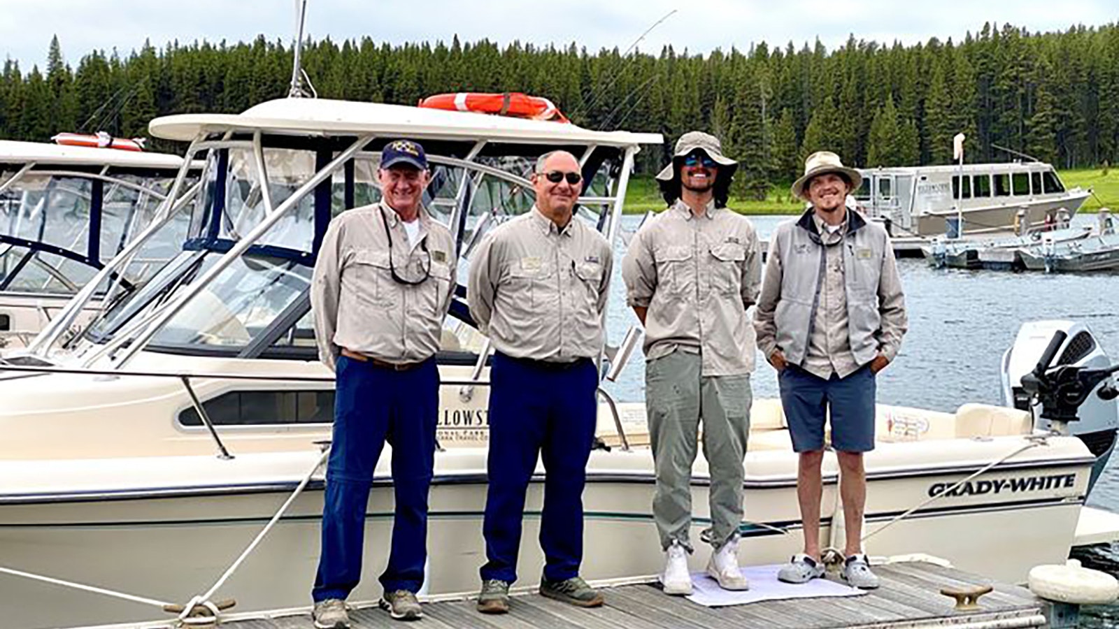 Yellowstone National Park Lodges tour boat employees, from left, Mike Young, Troy Siegel, Elijah Luna and Gregor Woodruff helped rescue a couple and their two small dogs after the man’s kayak capsized in the frigid waters of Yellowstone Lake.
