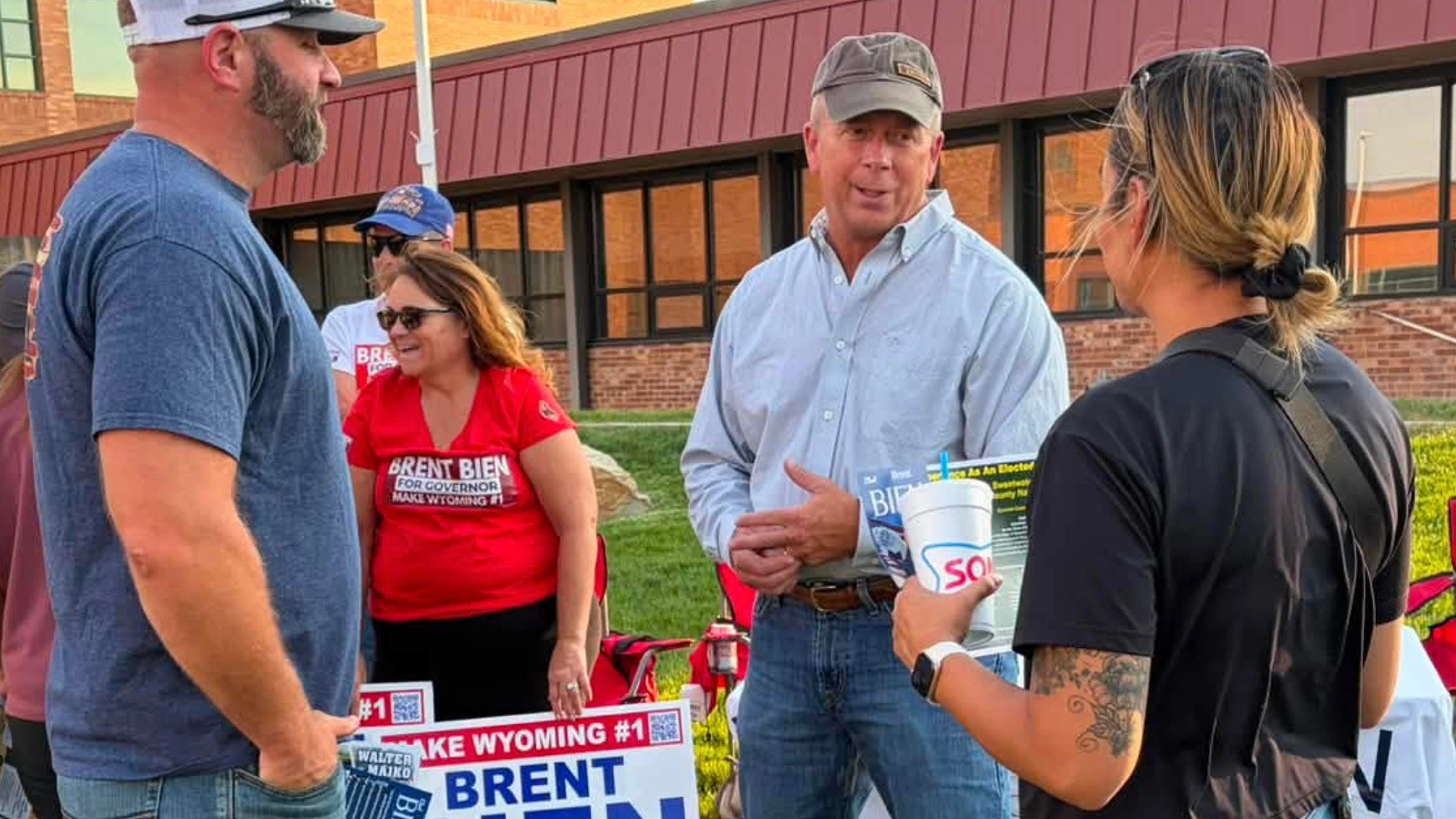 Brent Bien (center in light blue shirt) at a campaign event in August, 2026