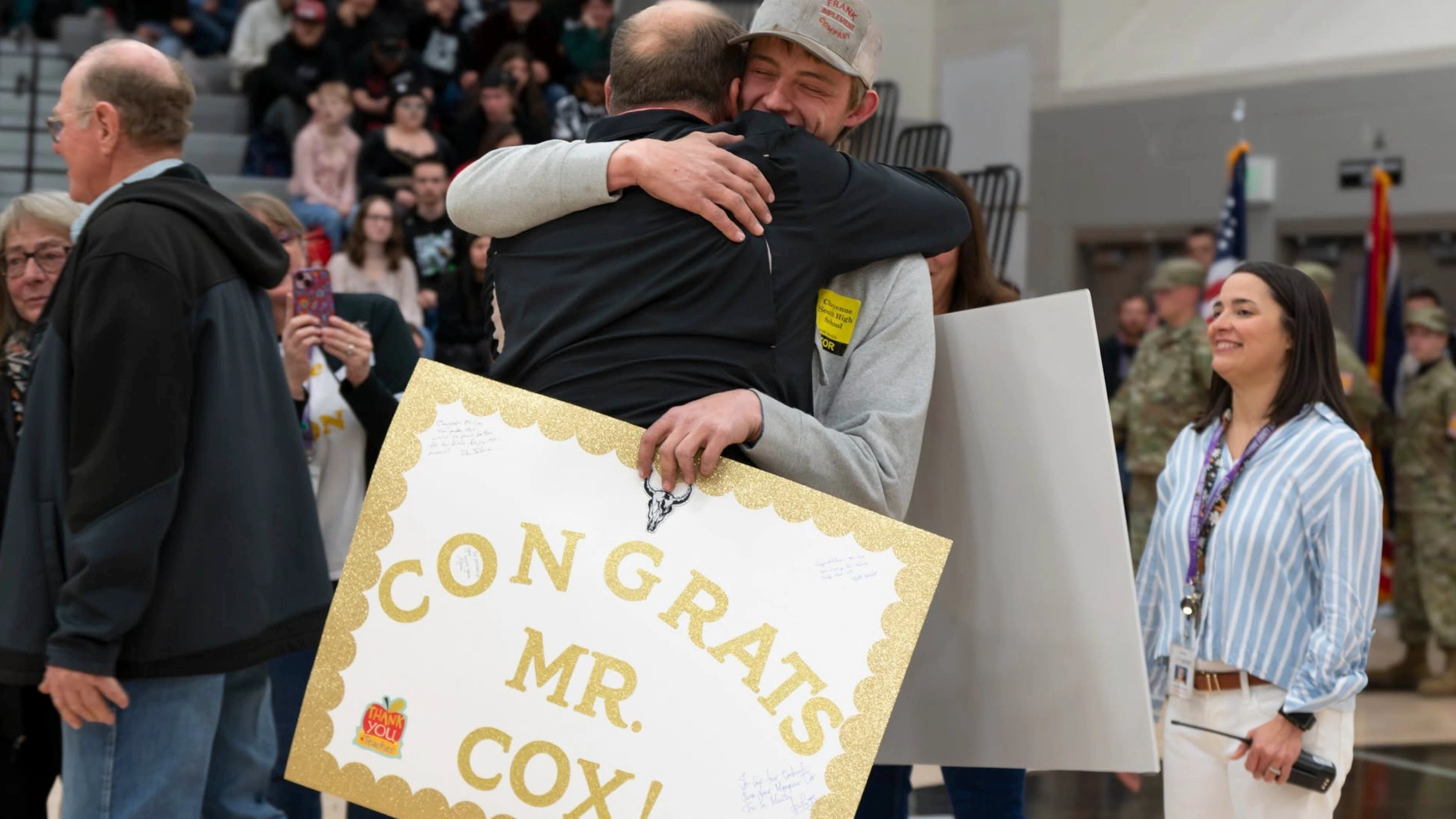 Brian Cox hugs a student after winning Larmie County School District 1's 2027 teacher of the year award in April. He went on to win the statewide title out of 48 teachers.