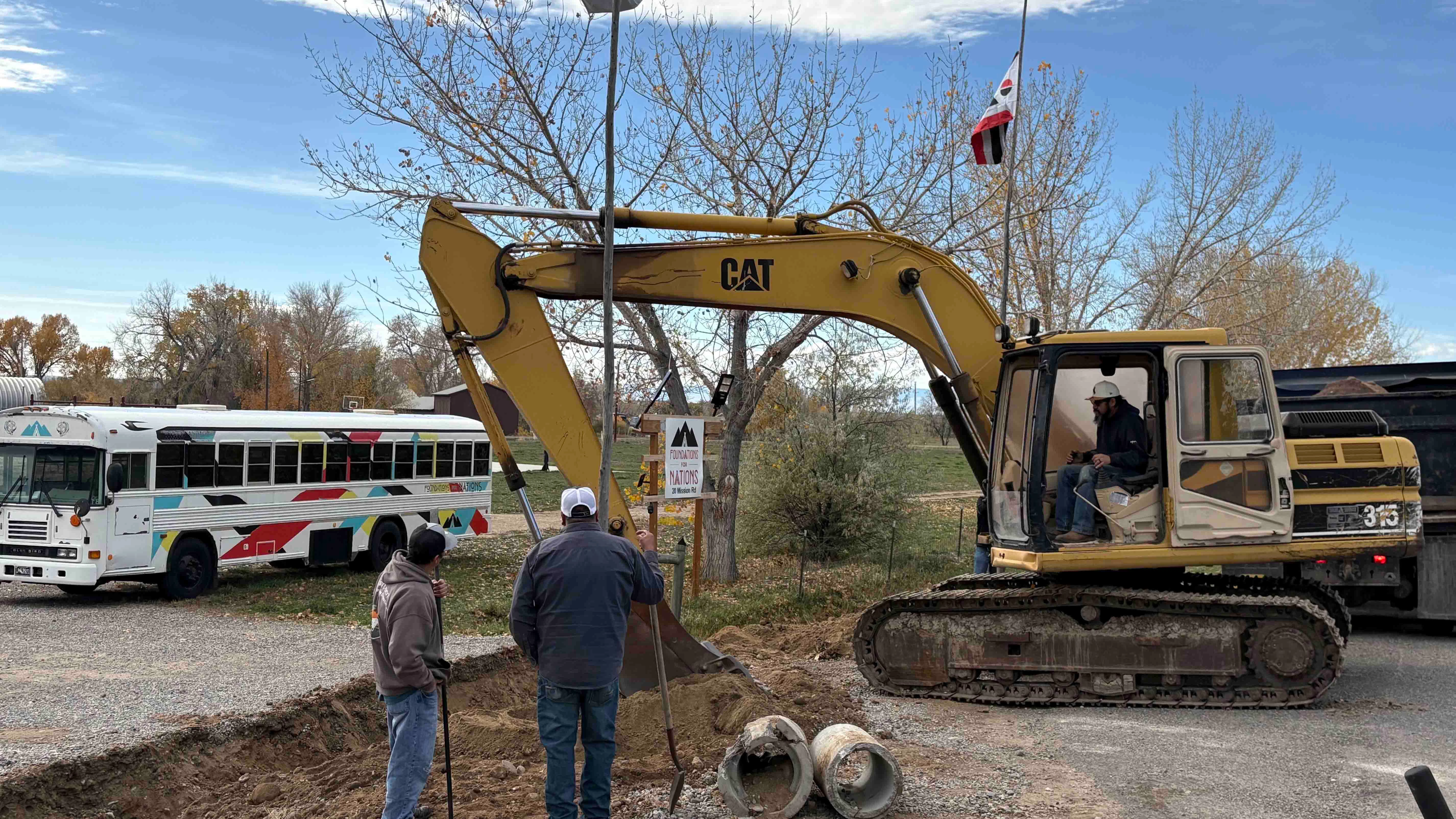 Northern Arapaho tribal leaders oversaw a heavy-equipment operation Thursday to remove a driveway entrance to the Foundations for Nations evangelical church, then plant tribal flags where the entrance had been.