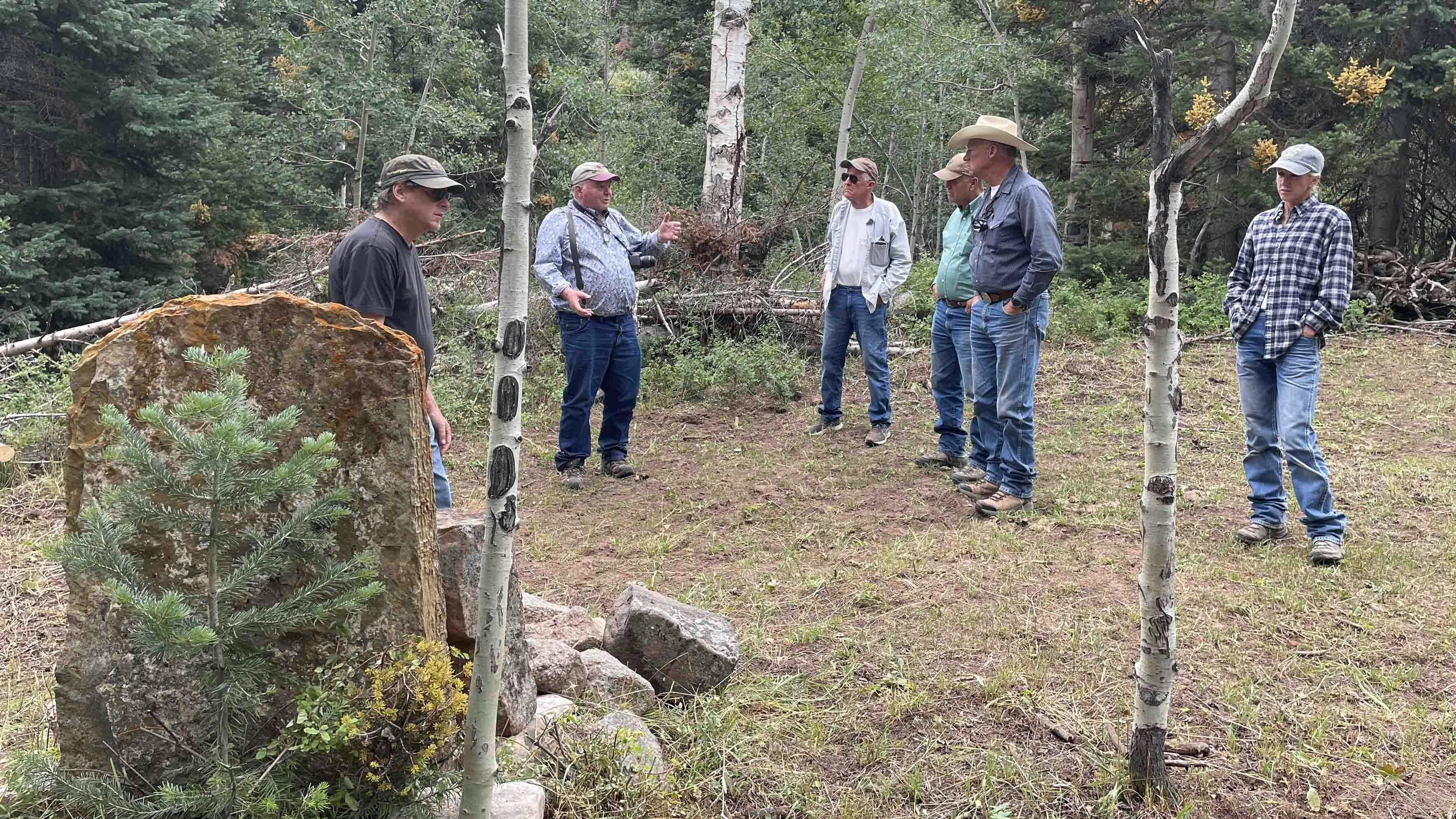Former Wyoming State Archaeologist Mark Miller, second from left, talks about the killing of Robert Widdowfield and Tip Vincent during a visit to the murder site